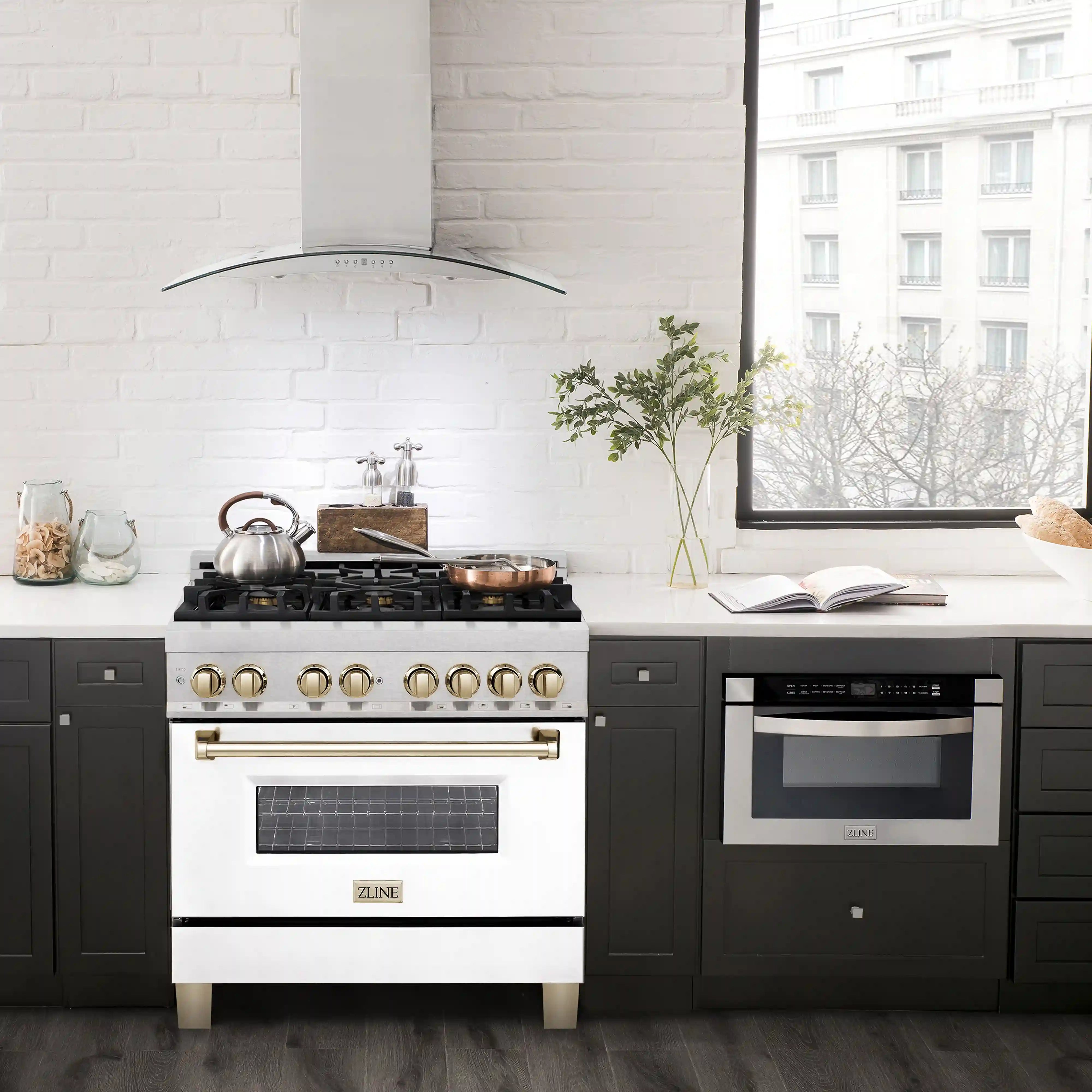 Dual fuel range with white oven door, satin stainless panel, and gold burner knobs