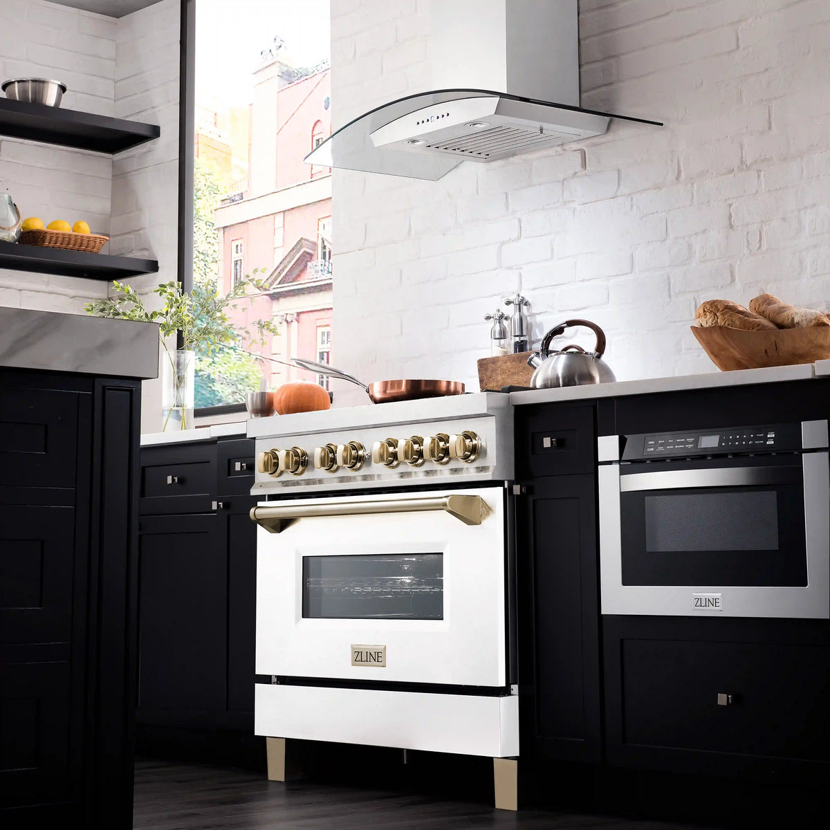 Dual fuel range front view with gold knobs, black cooktop grates, and white oven door
