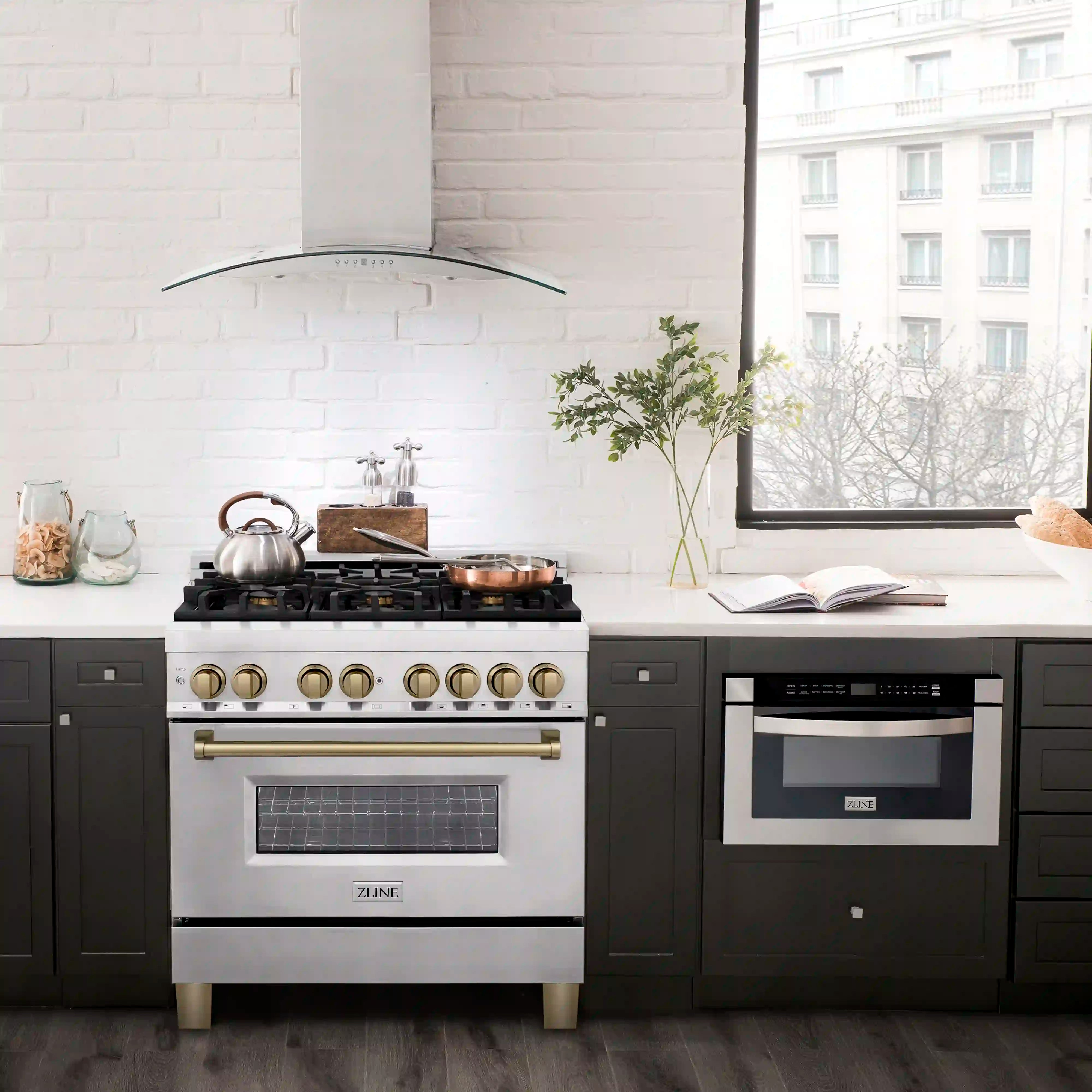 Stainless dual fuel range with bronze knobs and gas burners over an electric oven