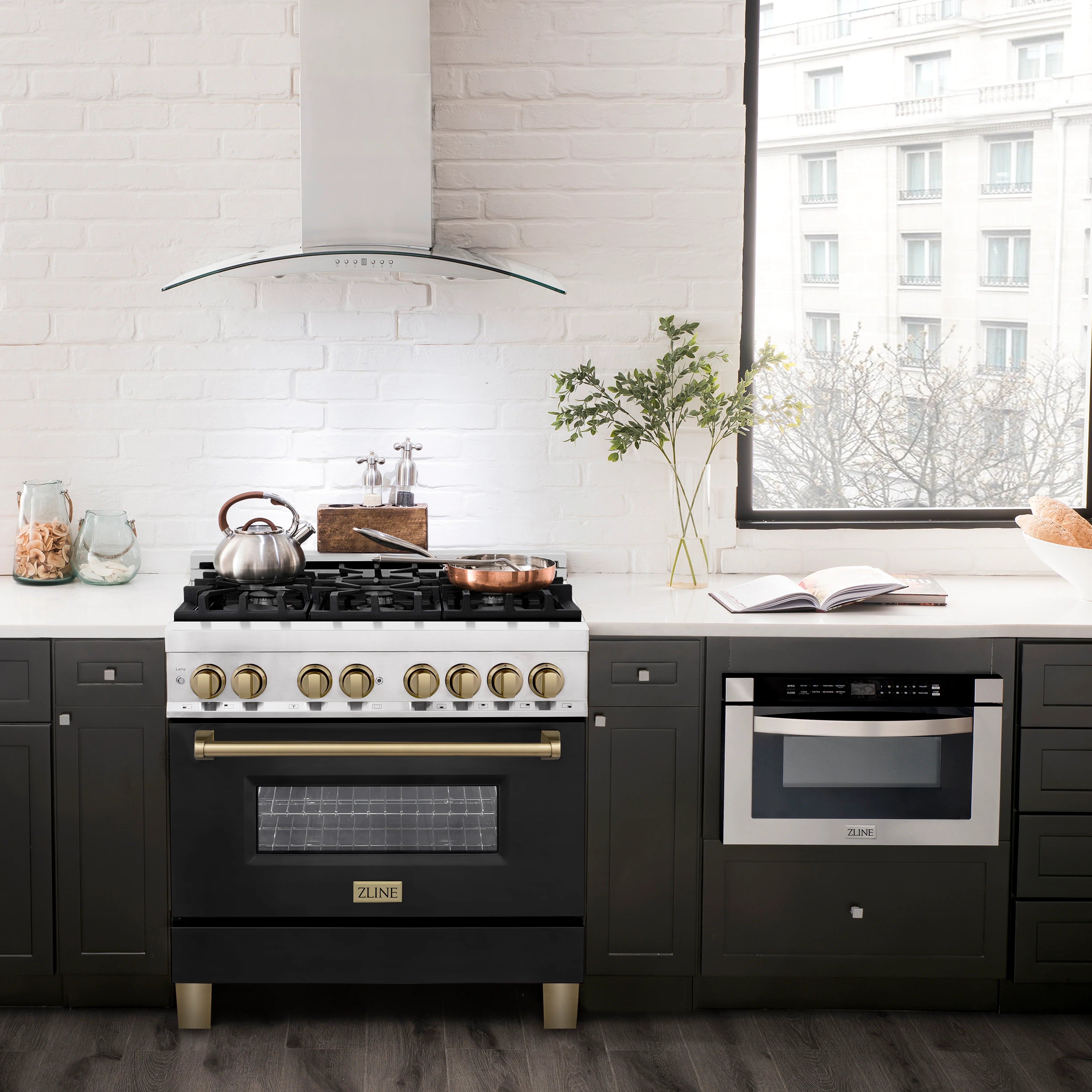 Dual fuel range with stainless body, black matte oven door, bronze control accents