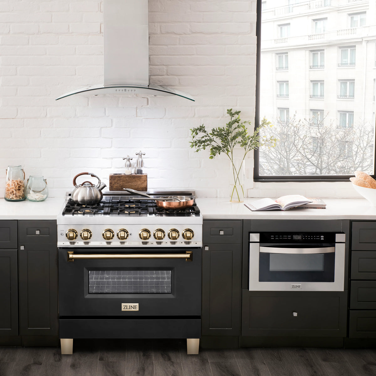 ZLINE dual fuel range in kitchen, stainless oven door with polished gold knobs