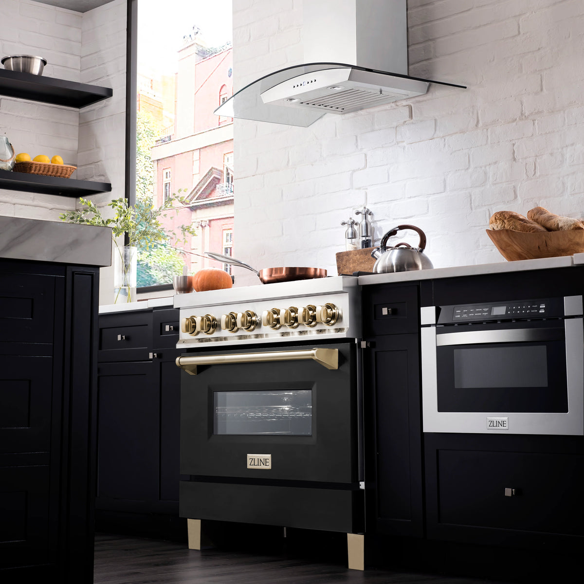 ZLINE dual fuel range in kitchen, polished gold knobs and black oven doors
