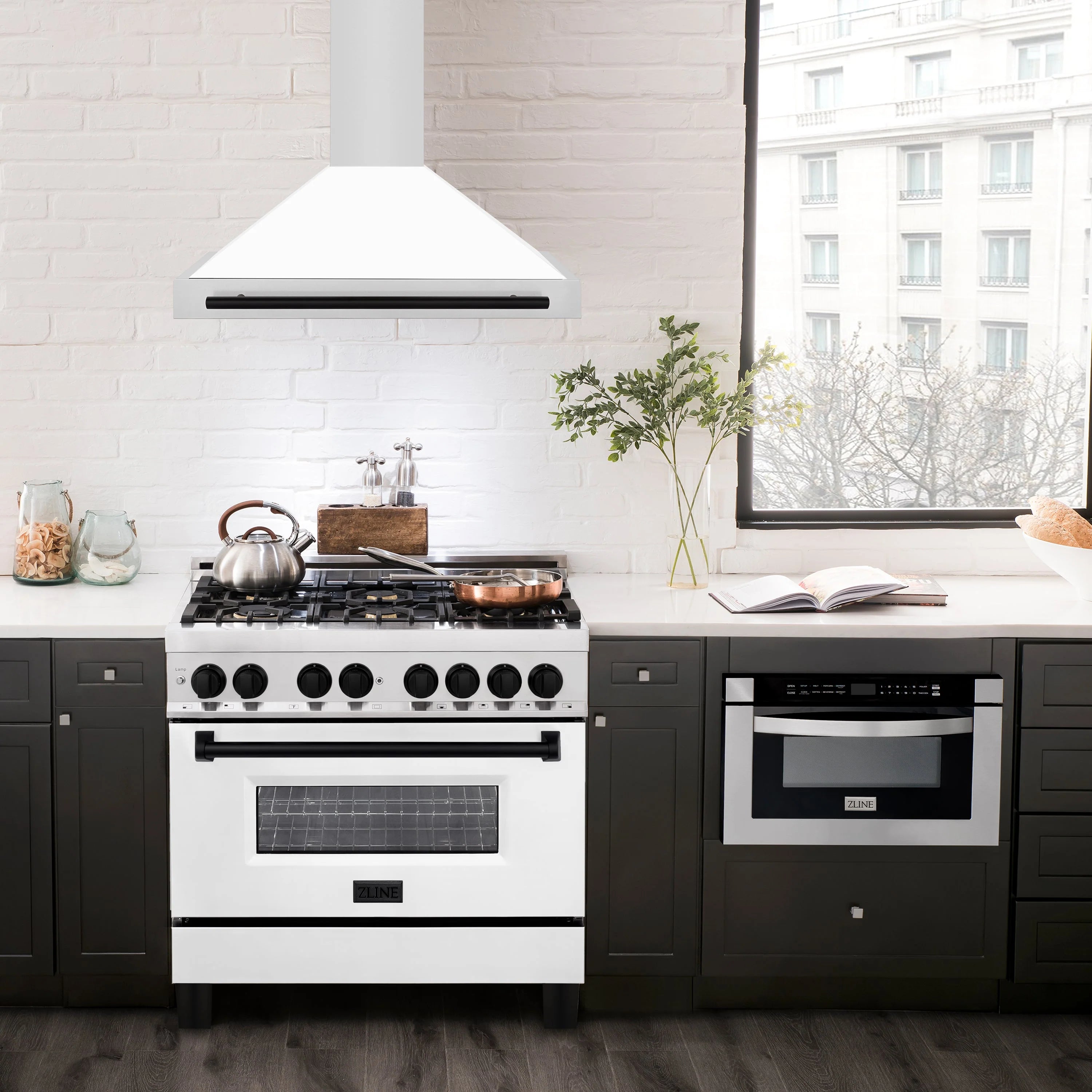 Wall-mounted range hood with white matte chimney, black visor, and stainless body