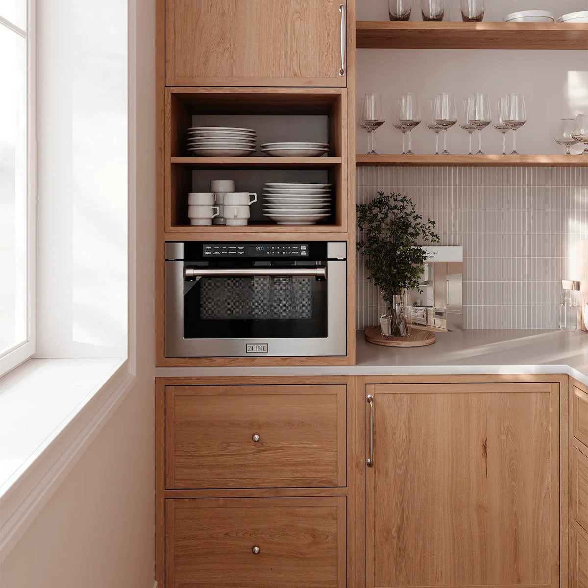Stainless built-in oven with black door and control panel, installed in cabinet opening, ZLINE