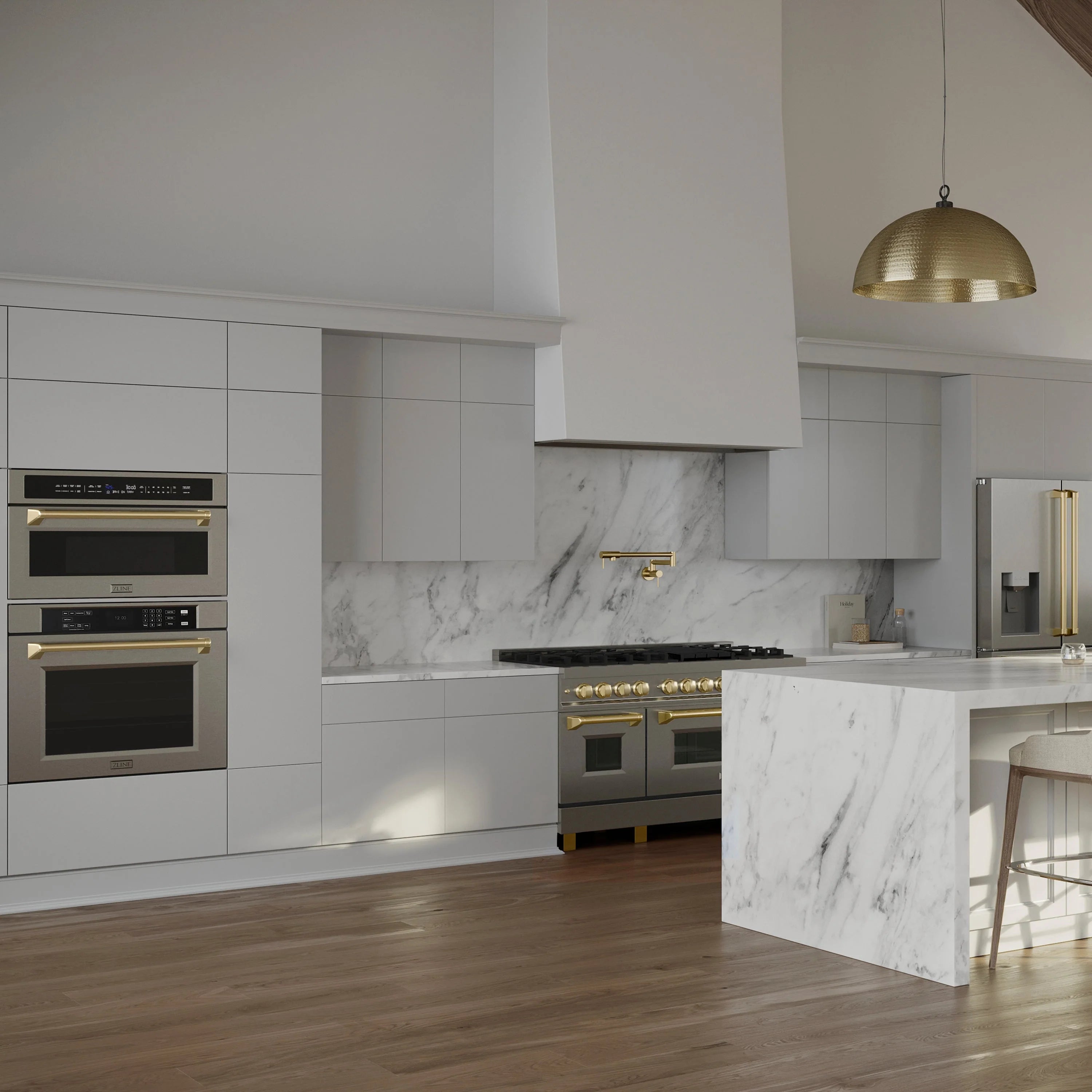 Built-in stainless steel oven and microwave with gold-trim door handles
