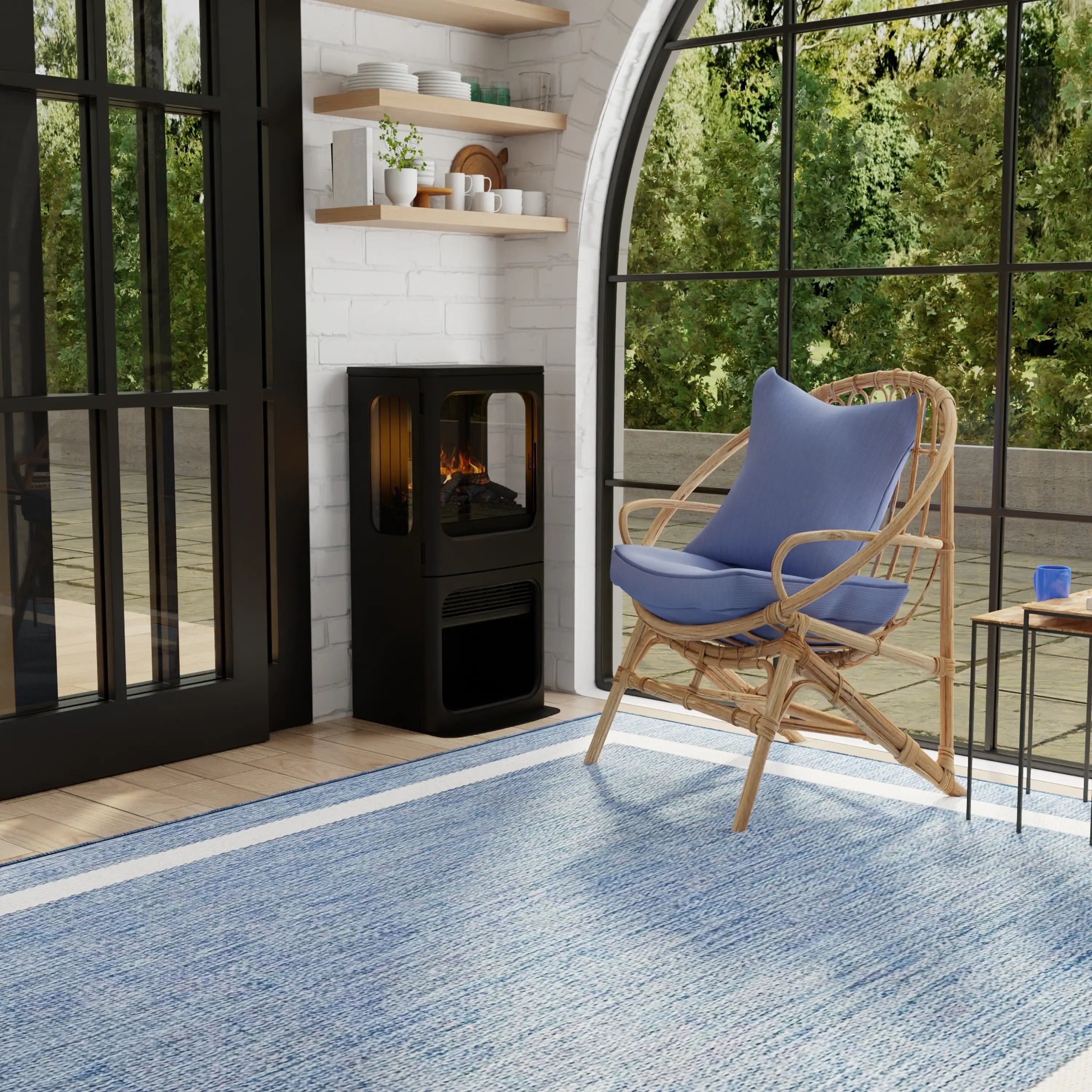 Freestanding black water vapor fireplace with glass flame window in a living room setting.