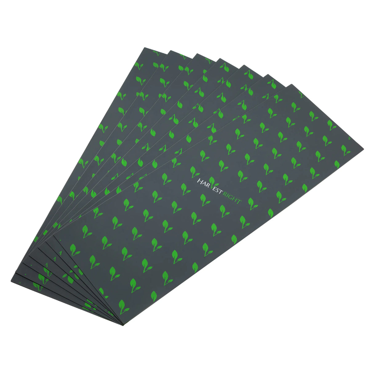 Dark gray silicone mats with repeating green leaf pattern, set of 7 stacked