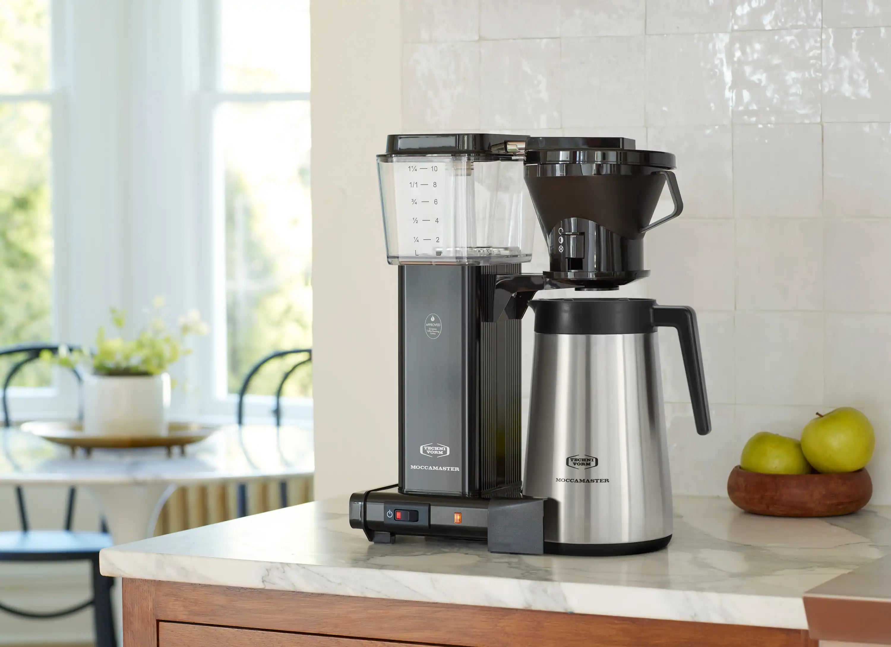 Black 10-cup drip coffee maker with stainless thermal carafe on countertop