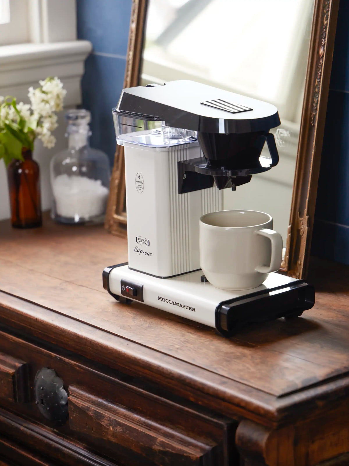Off-white Moccamaster Cup-One single coffee maker with black base and mug on wooden table