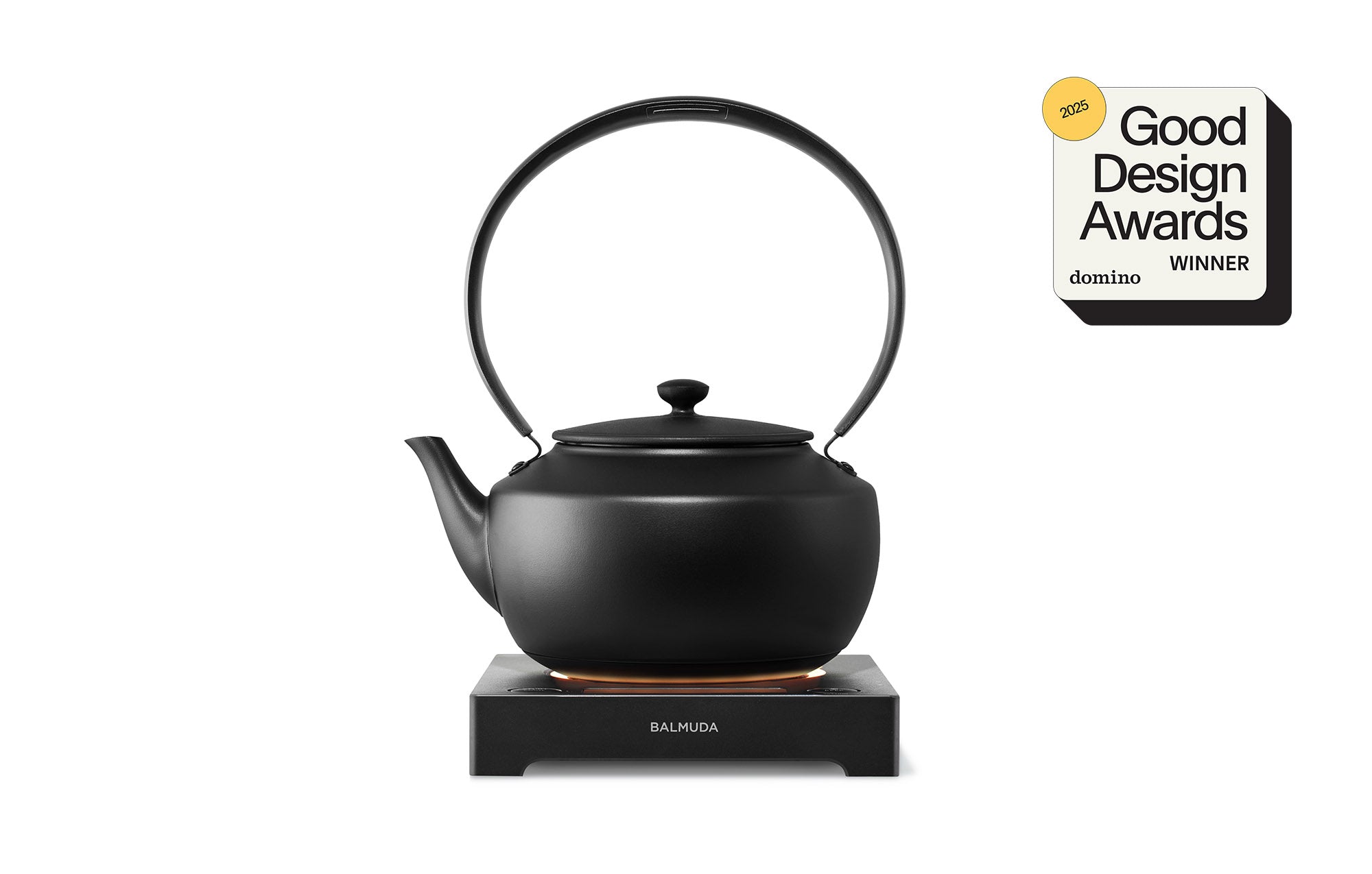 Black electric kettle with temperature control base and arched handle lid.