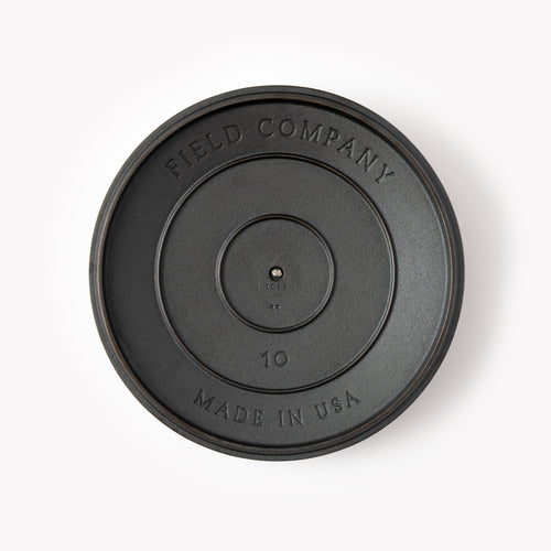 Cast iron pan lid with Field Company logo, '10', and 'MADE IN USA' text