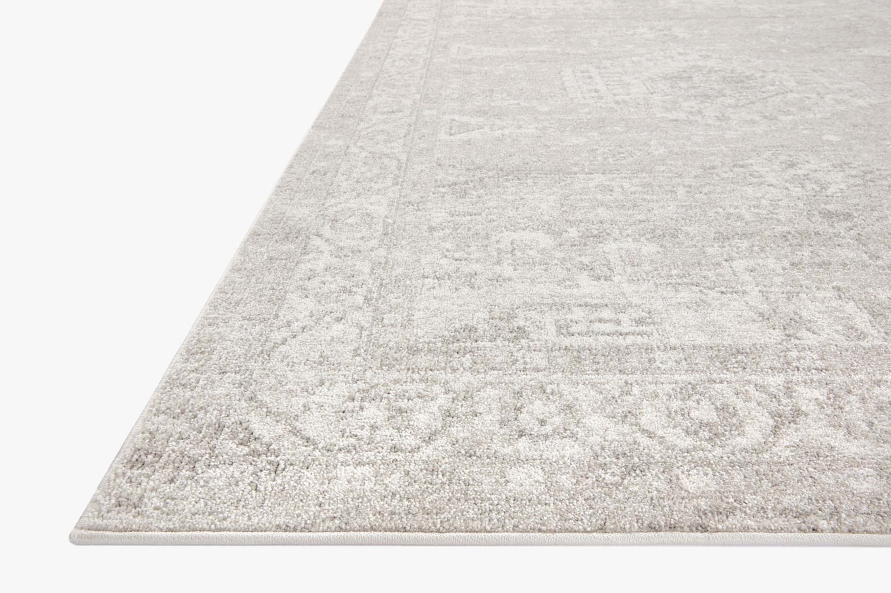 Ivory and silver traditional area rug with distressed medallion-style pattern