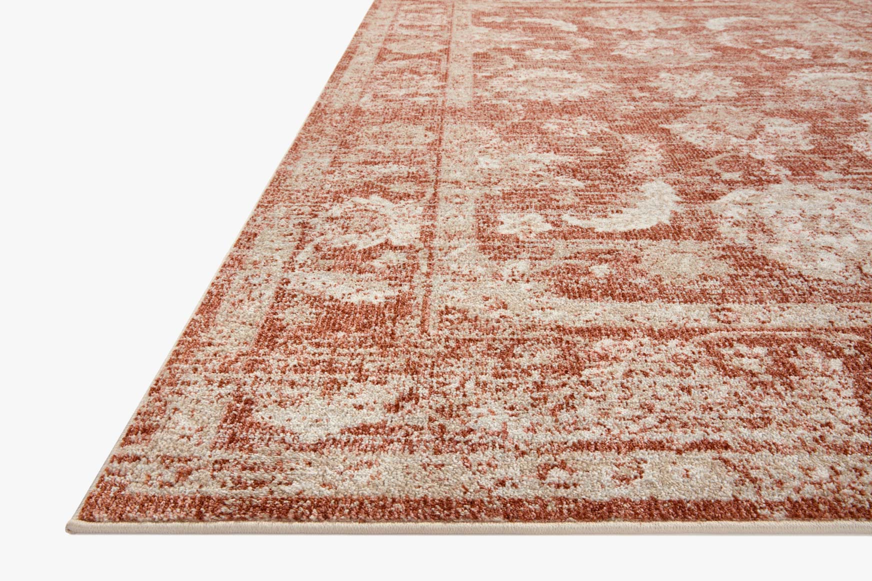 Rust and ivory traditional area rug with faded medallion pattern and border