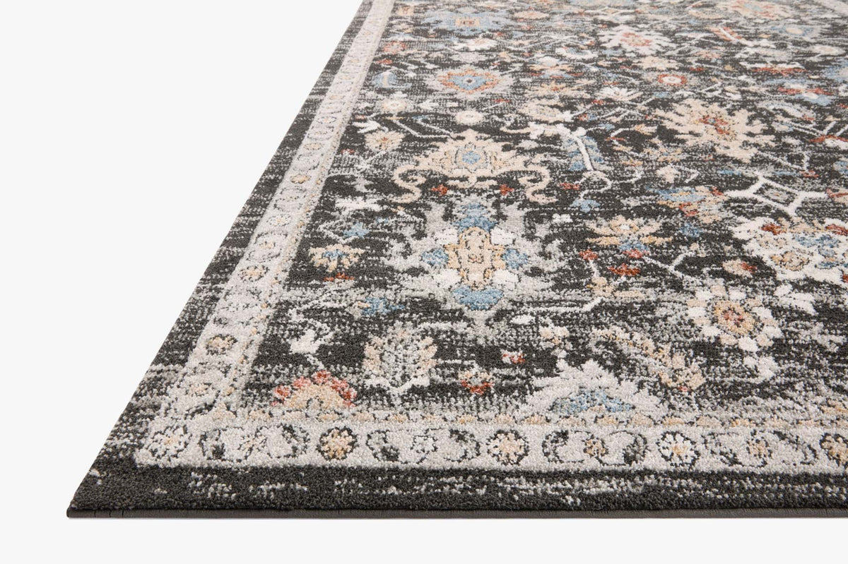 Charcoal traditional area rug with ornate multicolor motifs and patterned border