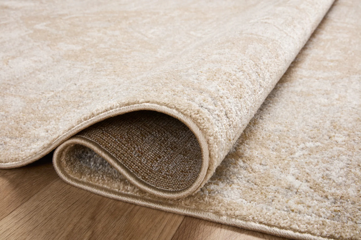 Beige and silver runner rug detail with rolled edge and low-profile flat weave.