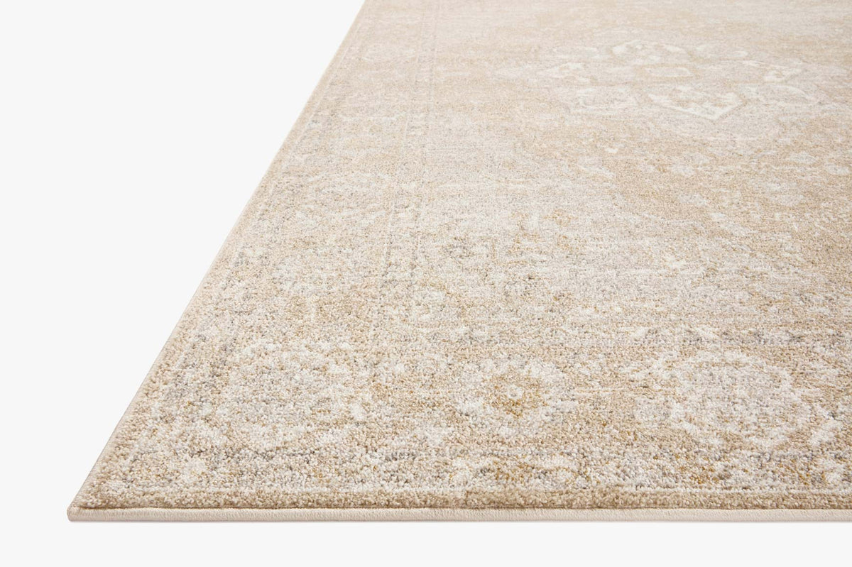 Traditional beige and silver area rug with distressed medallion pattern, corner view