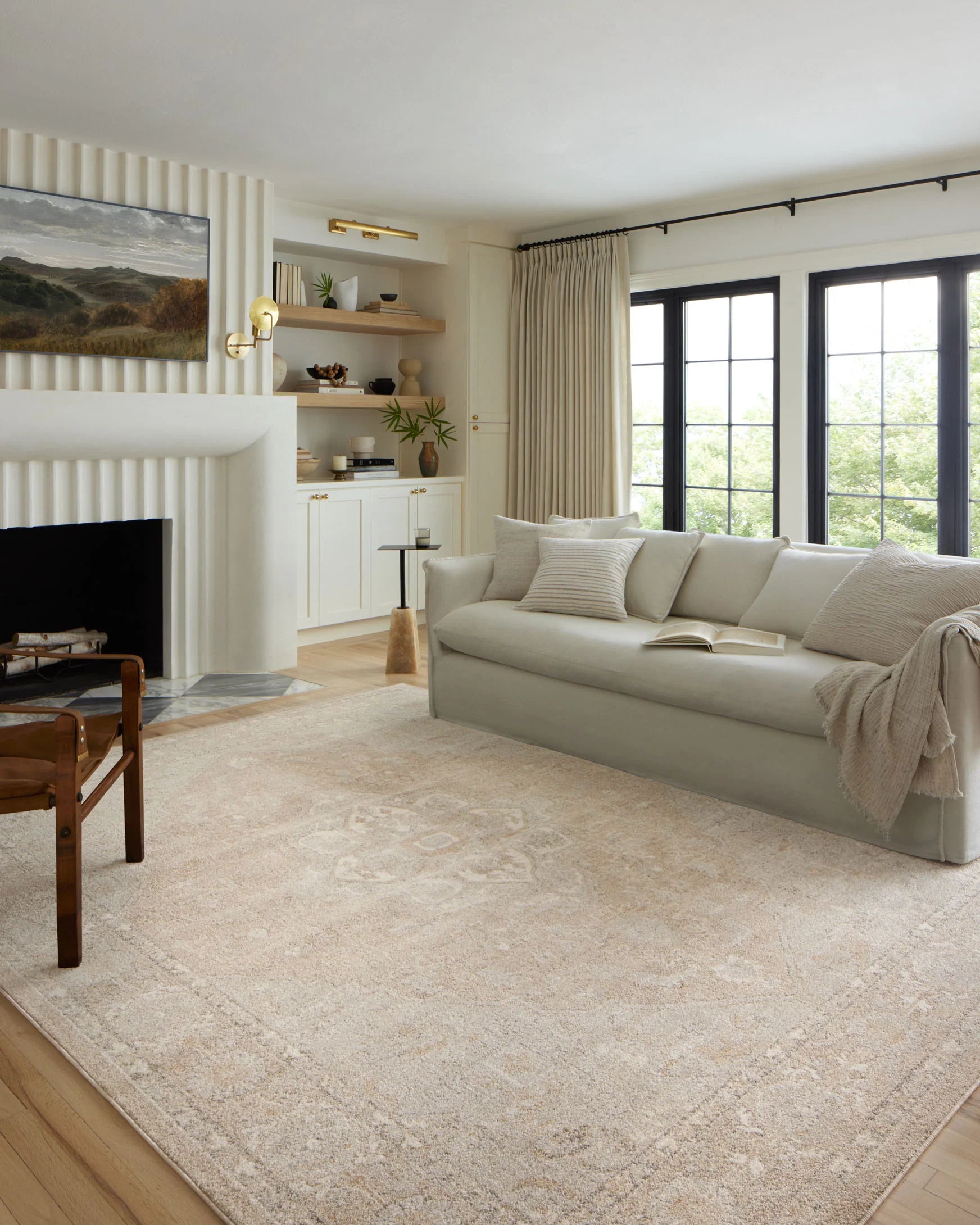 Beige and silver traditional 7'10" round area rug with distressed pattern and low textured pile