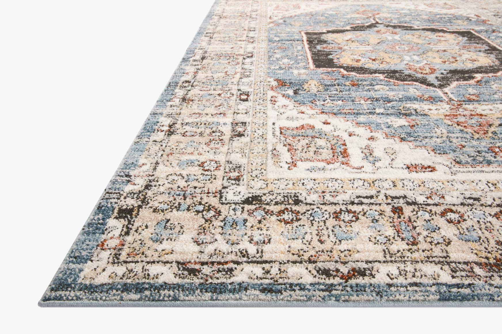 Traditional area rug in light cream with blue and rust distressed geometric medallion pattern