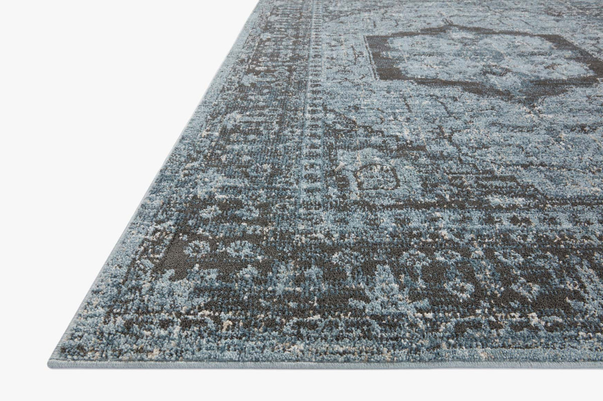 Traditional runner rug with distressed blue-gray and charcoal geometric medallion pattern