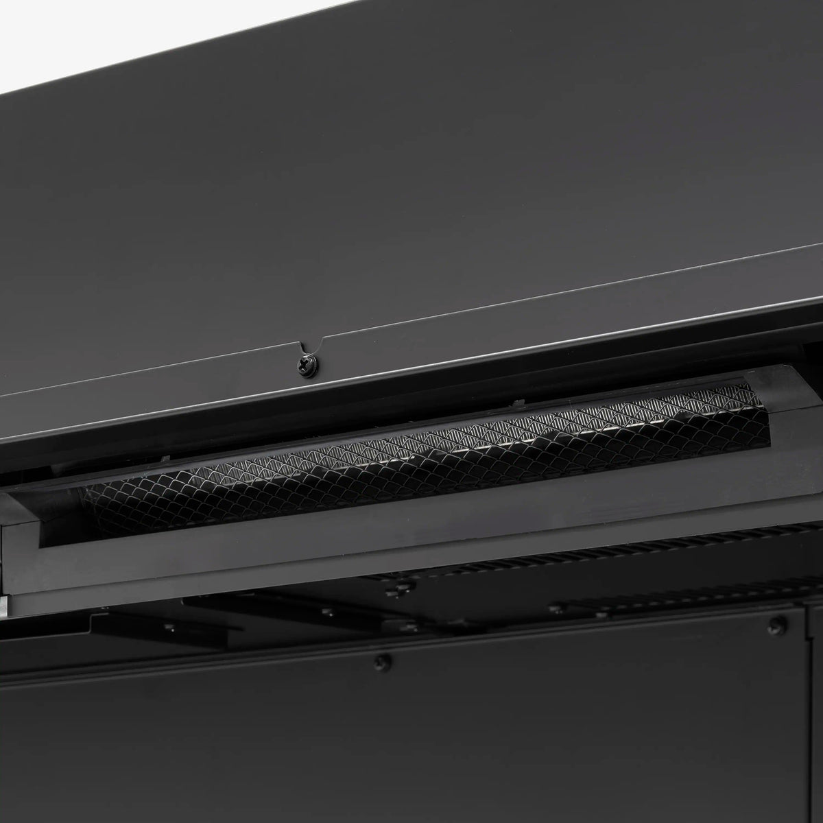 Linear water vapor fireplace with dark trim and mesh intake grille detail