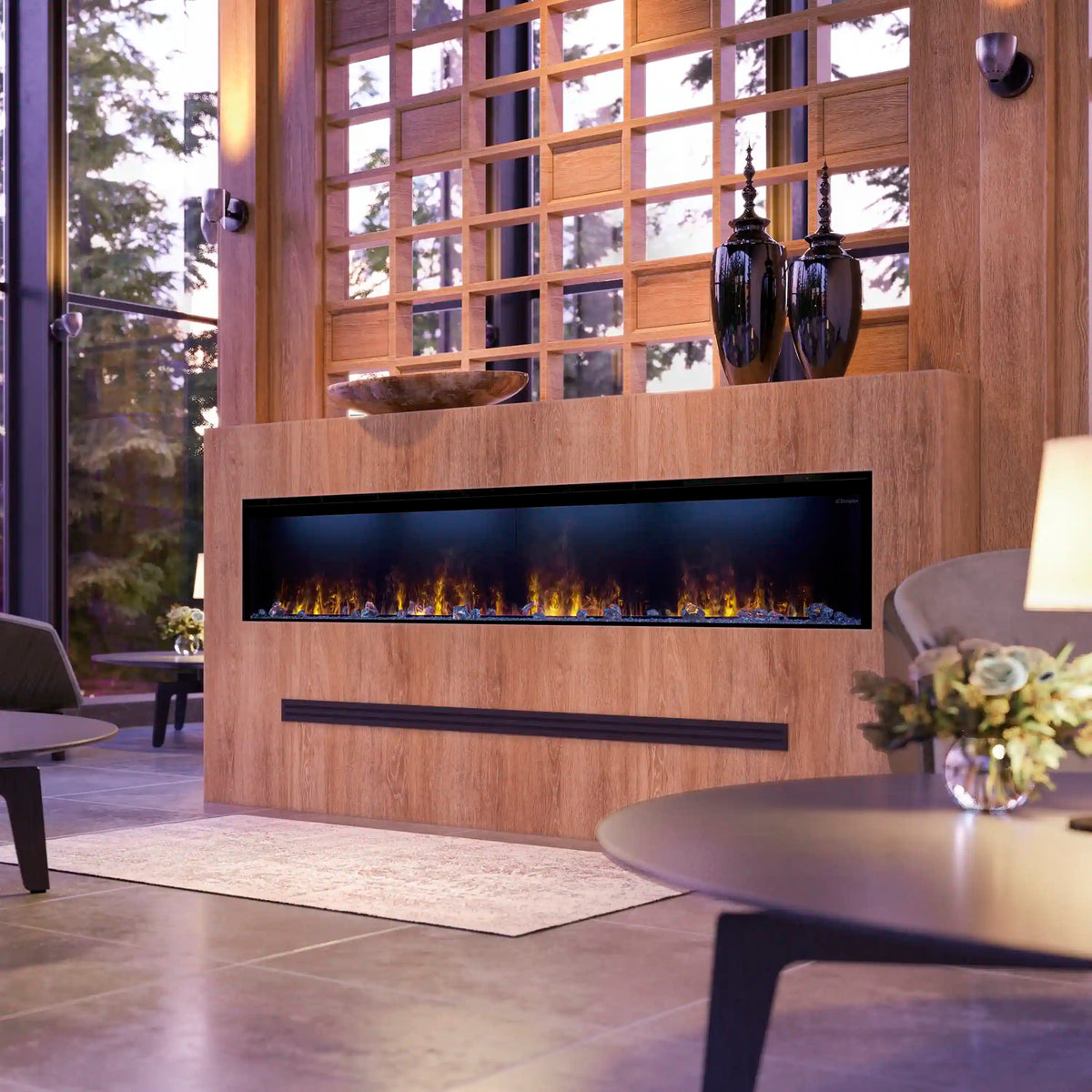 Linear water vapor fireplace interior with clear acrylic ice and driftwood pieces