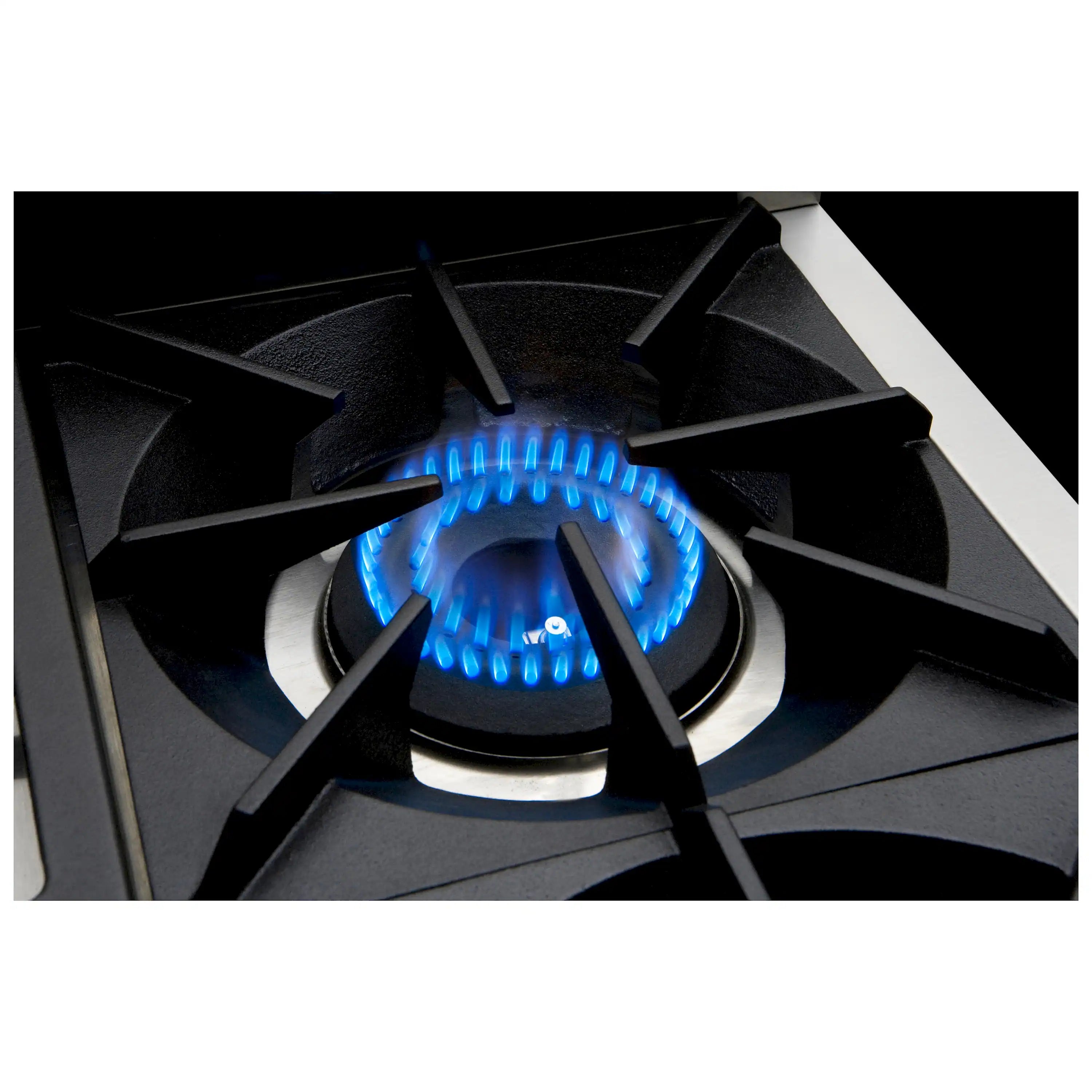 Sealed gas burner with blue flame and black grate on stainless cooktop