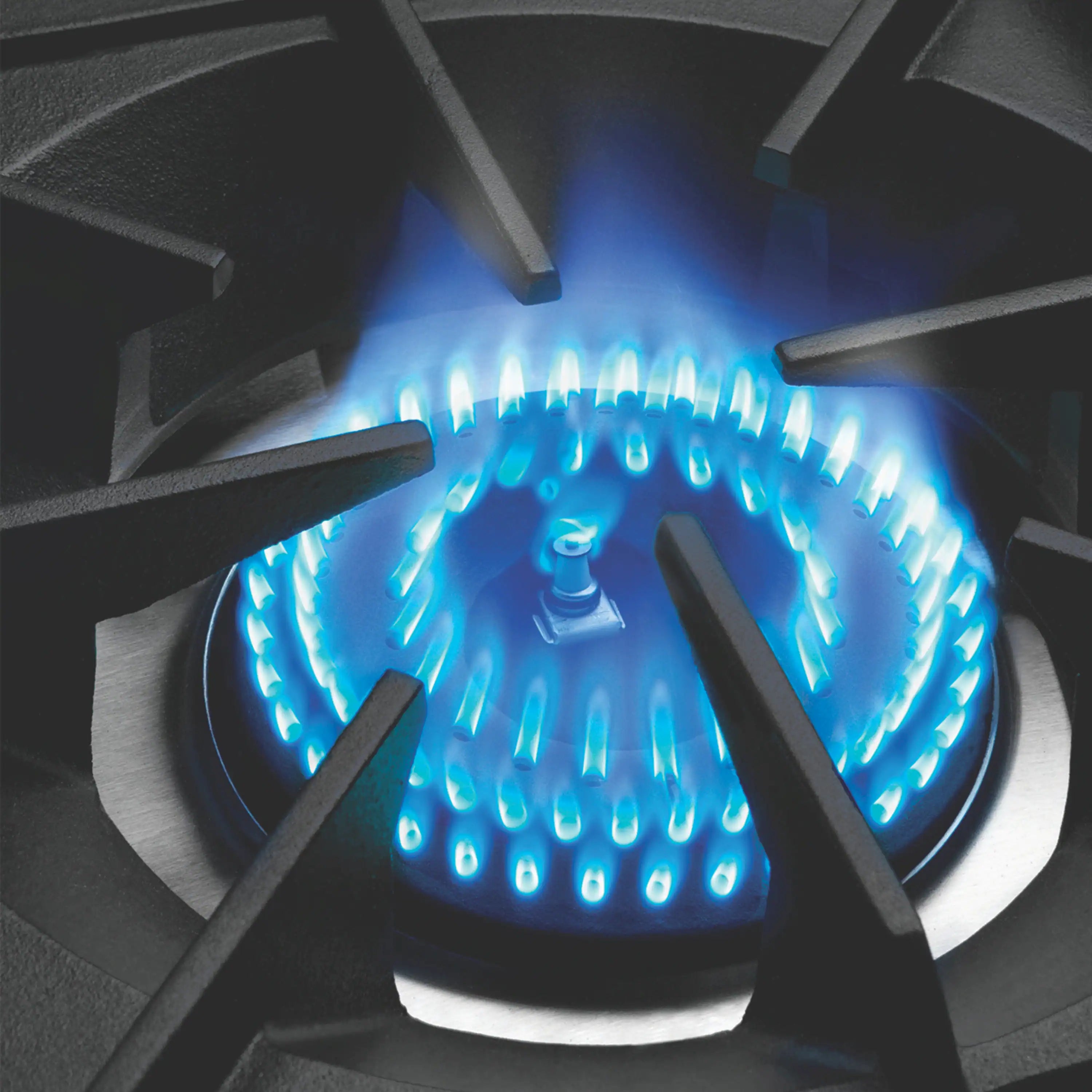 Blue gas burner flame on black grates with cast-iron burner heads