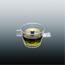 Clear Omni tea brewer with yellow tea liquid and upper metal control knob