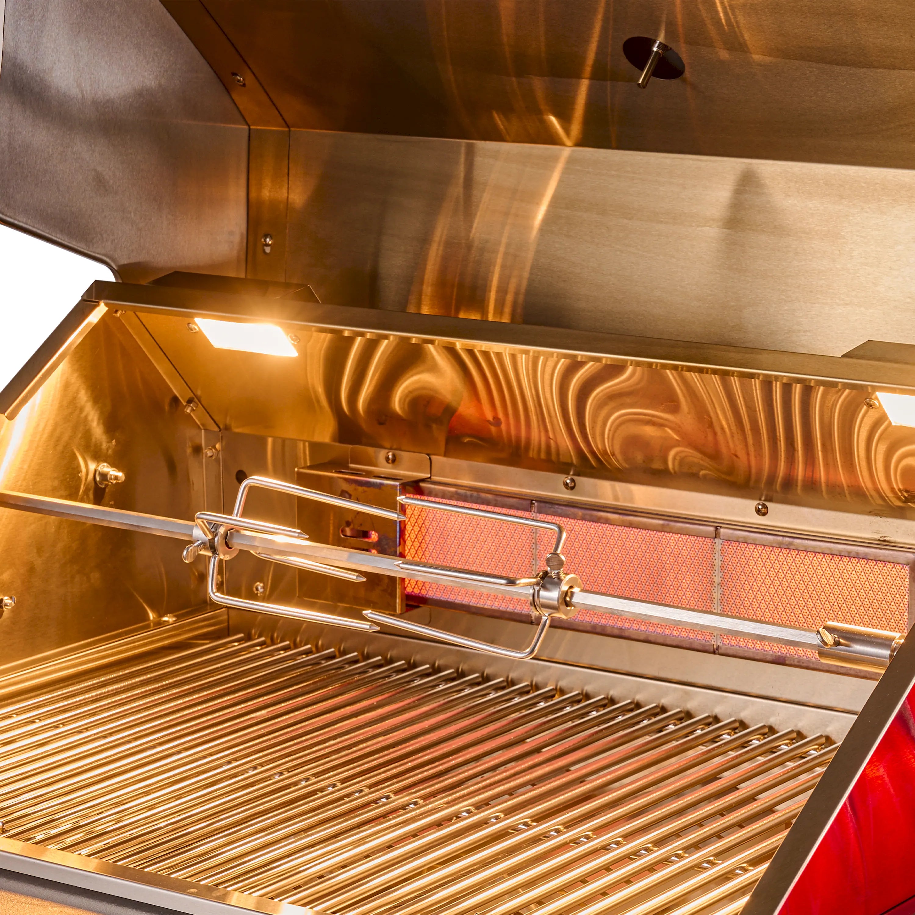 Open stainless BBQ grill with glowing infrared burner across the cooking chamber