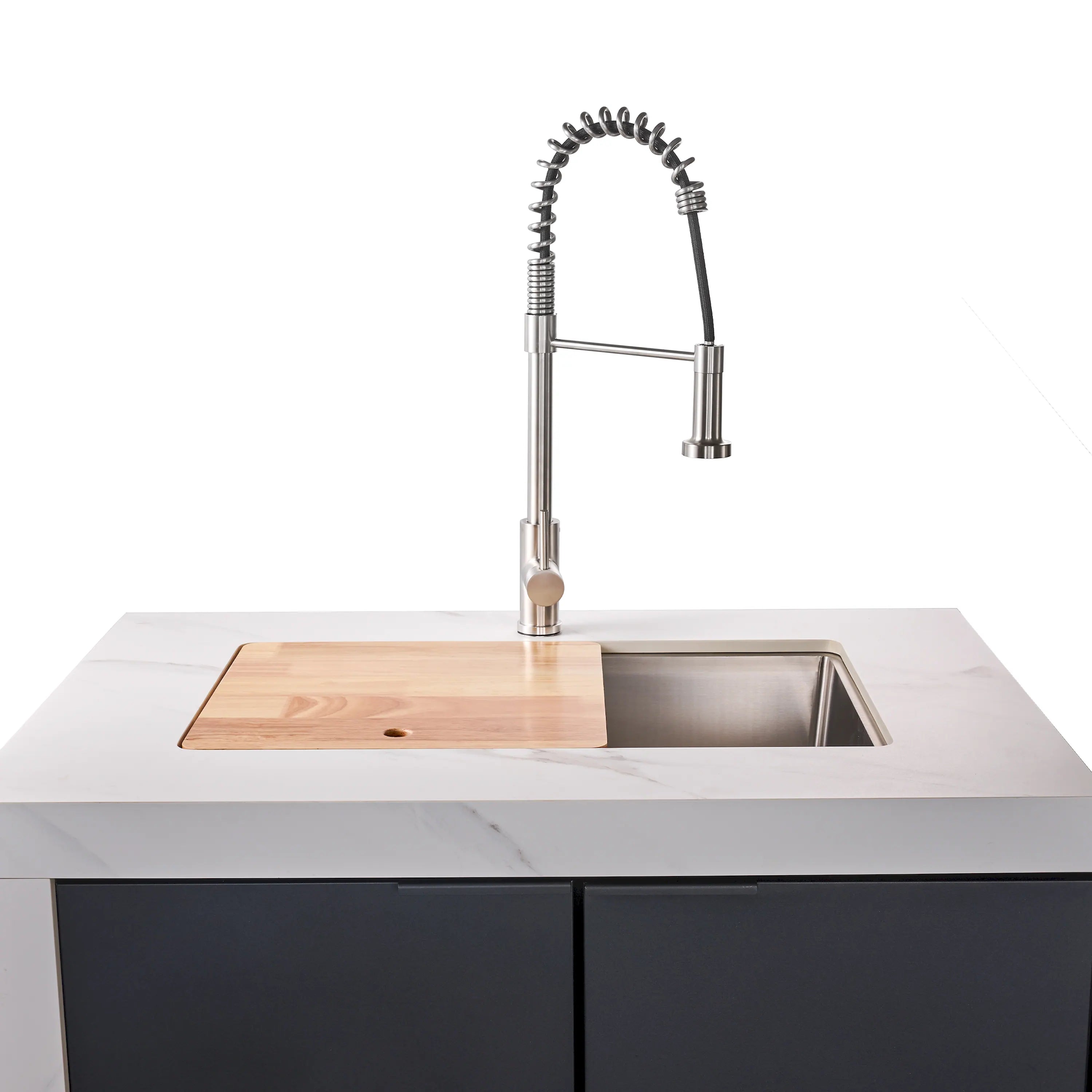 Outdoor kitchen sink with tall chrome faucet and stainless basin on white countertop.