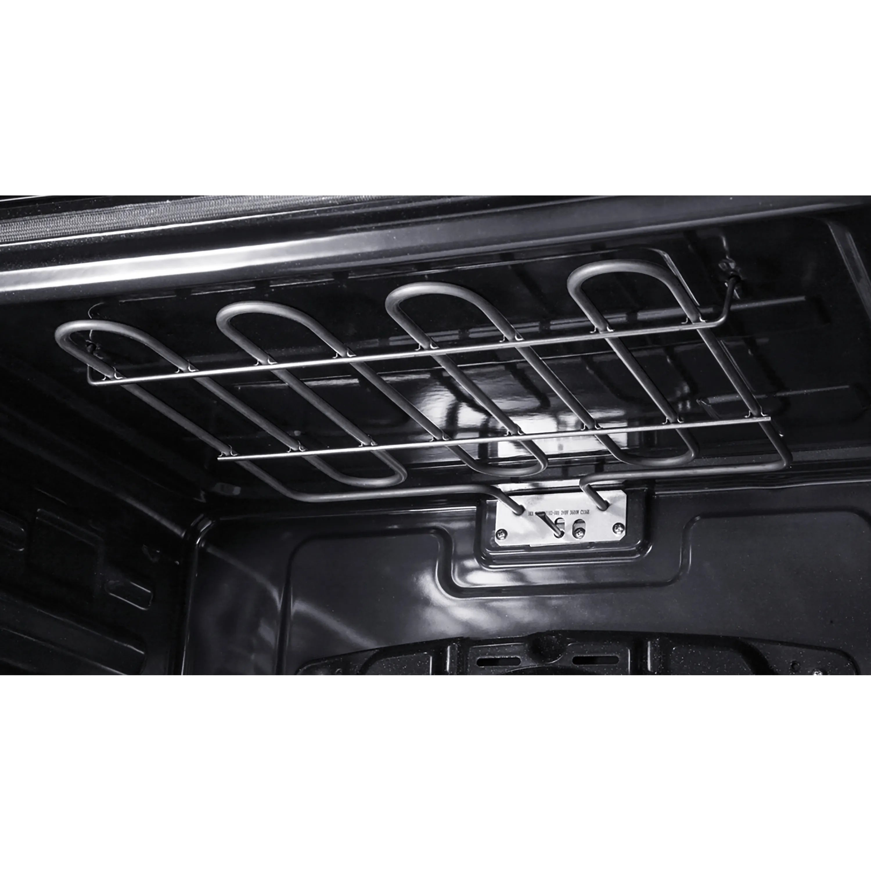 Open oven cavity showing wire rack and heating components in black interior