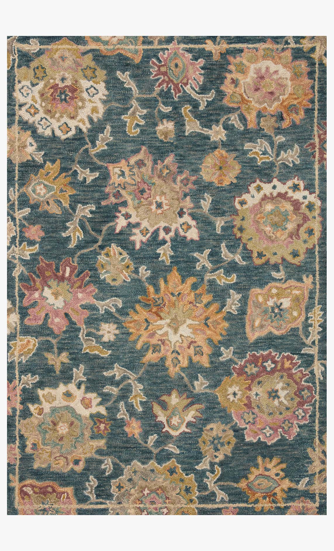 Round navy accent rug with ornate multicolor botanical pattern and decorative border