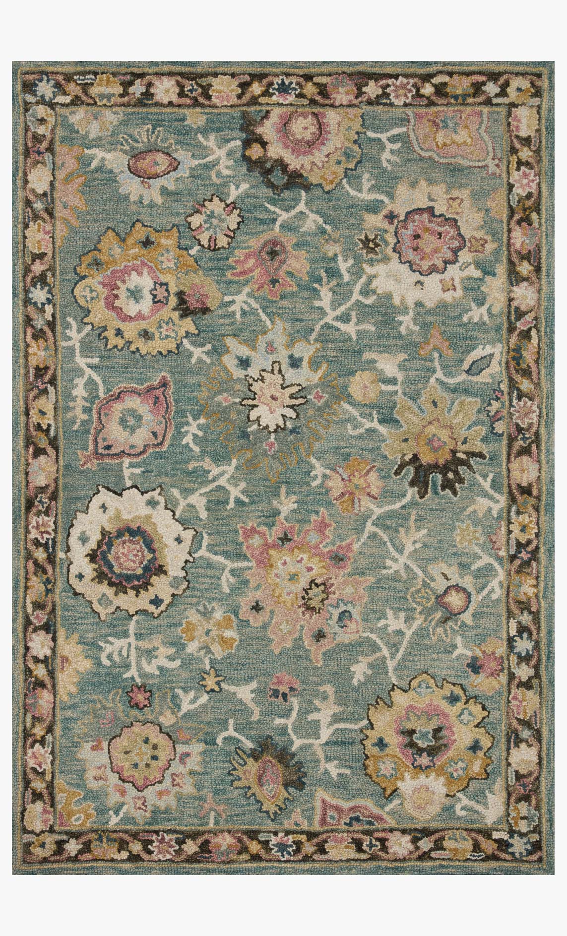 Rectangular teal accent rug with ornate floral and star-like motifs and border.