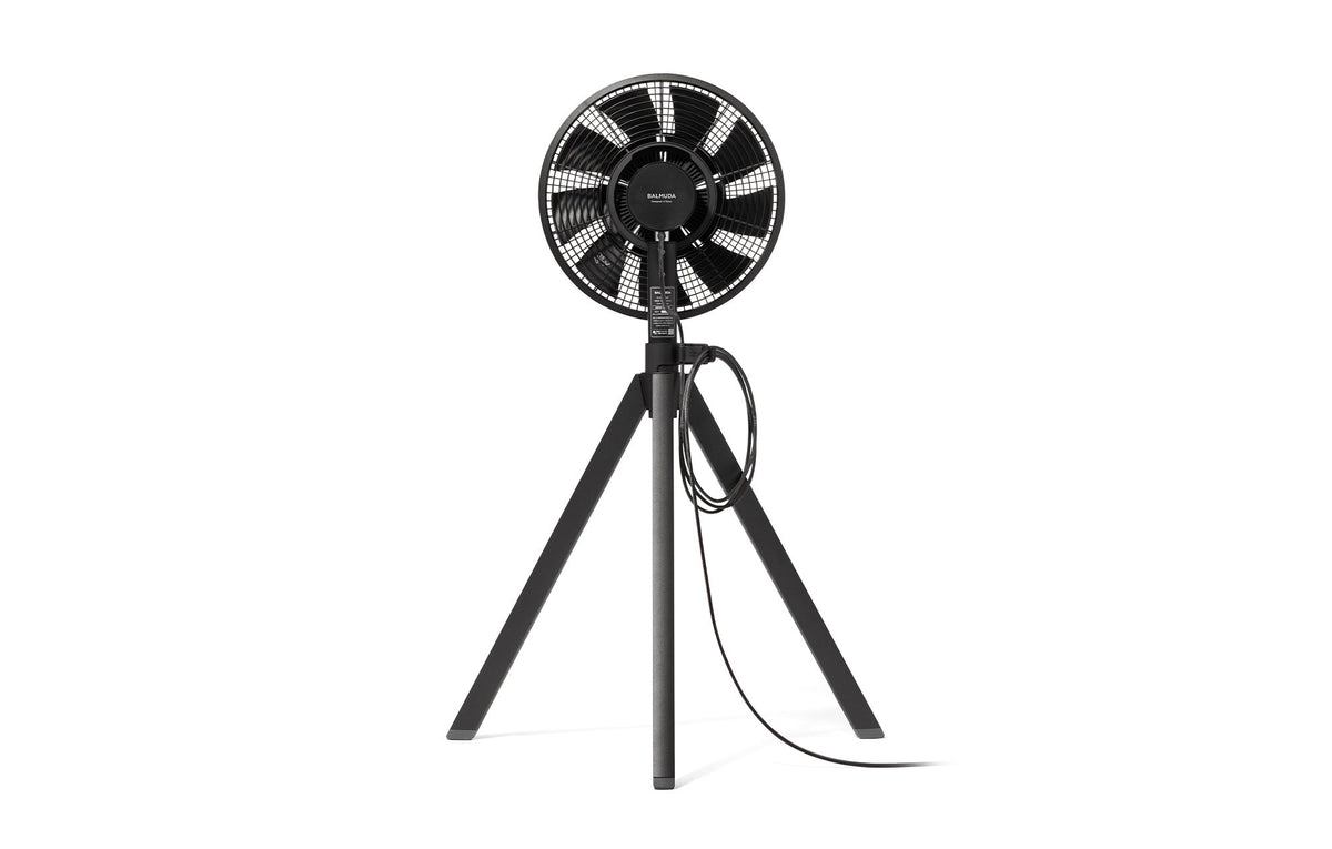 Black 12-inch portable fan front view with circular grille and tripod legs