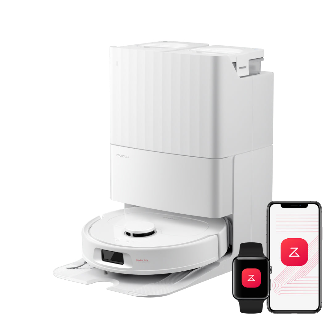 White robot vacuum docked beside a charging station with two app screens