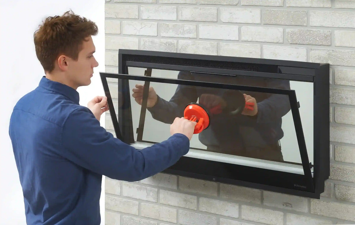 Black built-in linear electric fireplace insert with glass front and frame