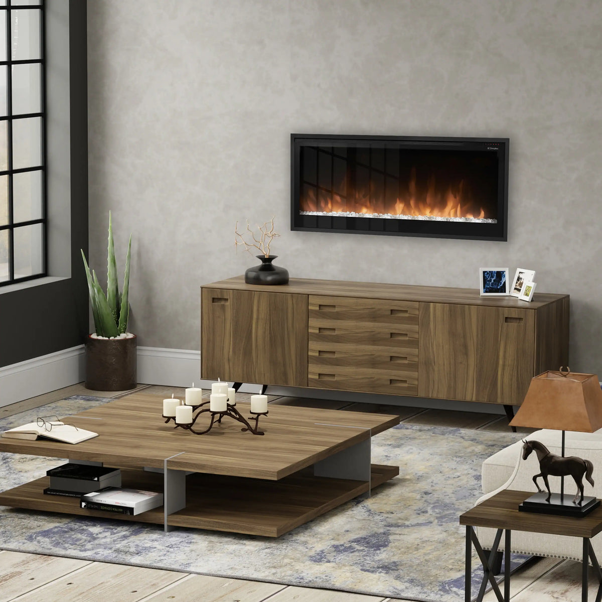 Linear electric fireplace with black front frame and orange flame view above wooden console