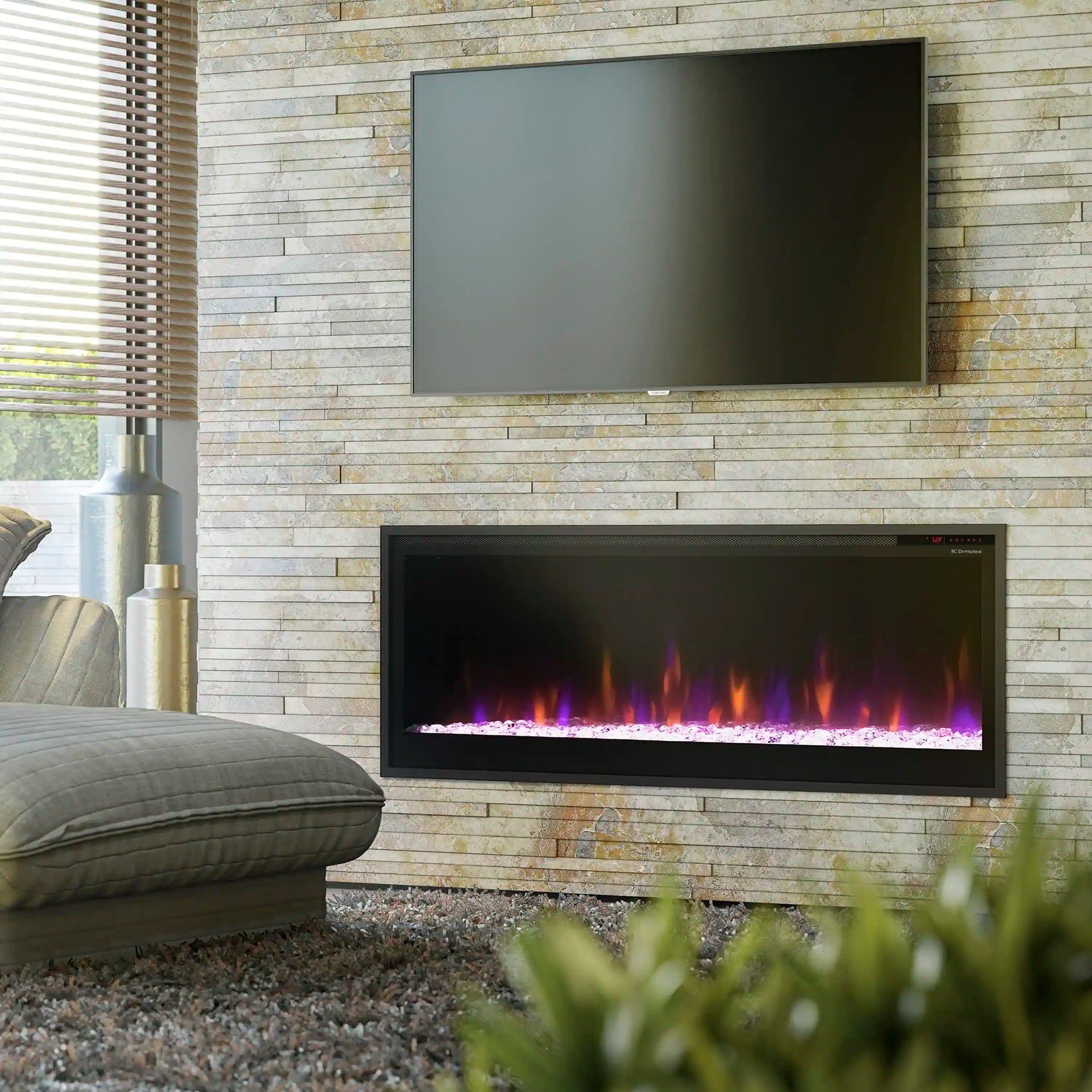 Built-in linear electric fireplace with black frame installed in a wall opening with flames