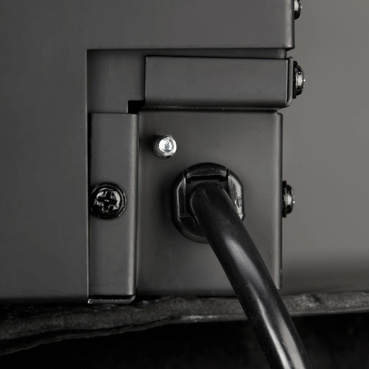 Black electric fireplace control side panel with power connector and cable