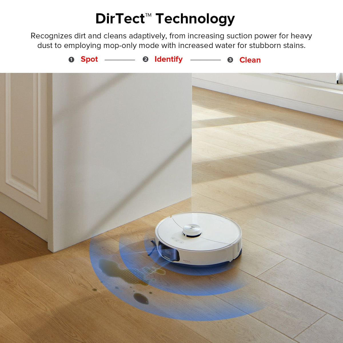 White robot vacuum cleaning along a doorway threshold
