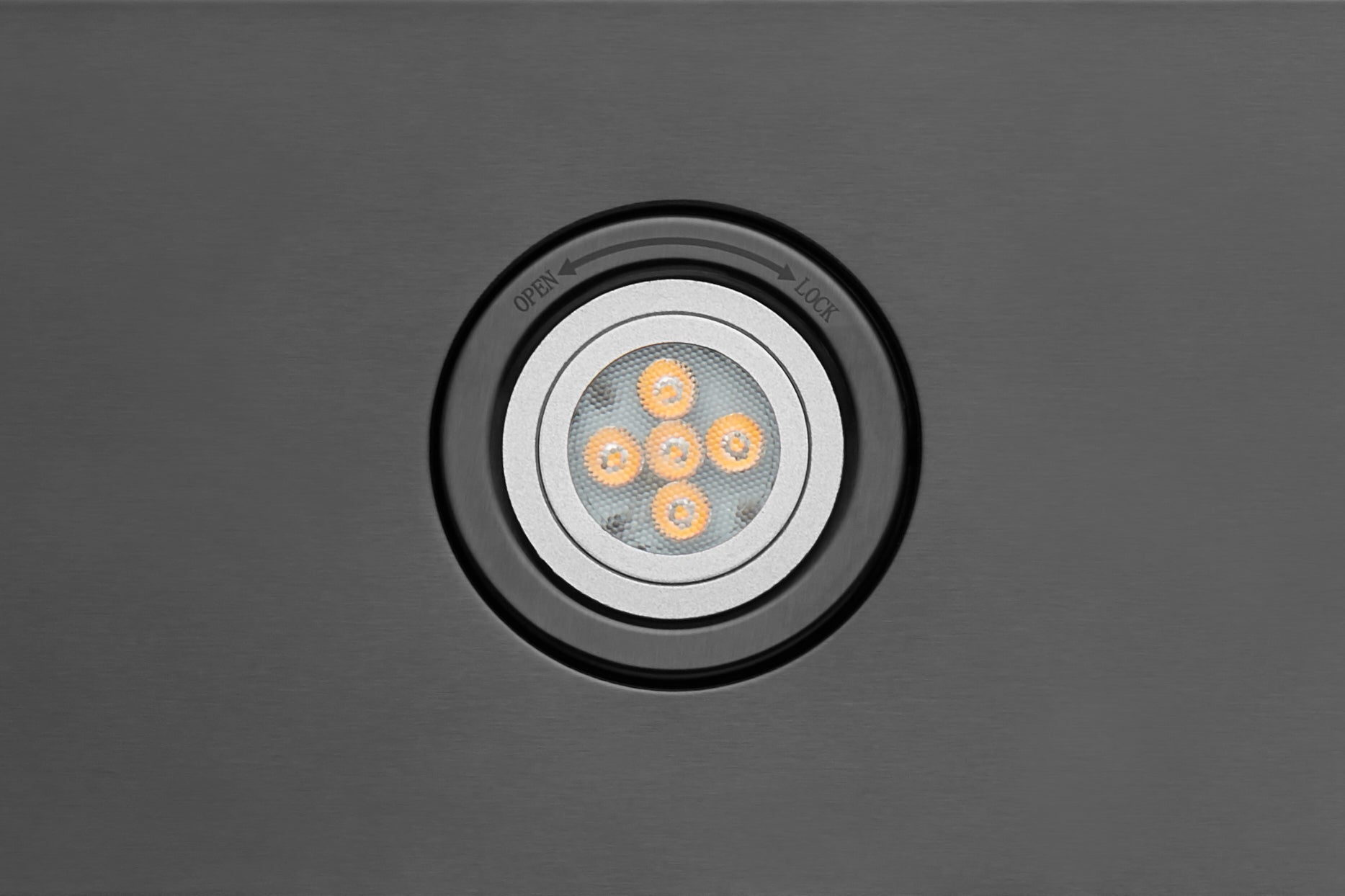 Under-cabinet LED light module with round bezel and multi-LED lens center