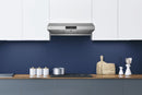 Range hood with stainless chimney and black vent grille under-cabinet mount.