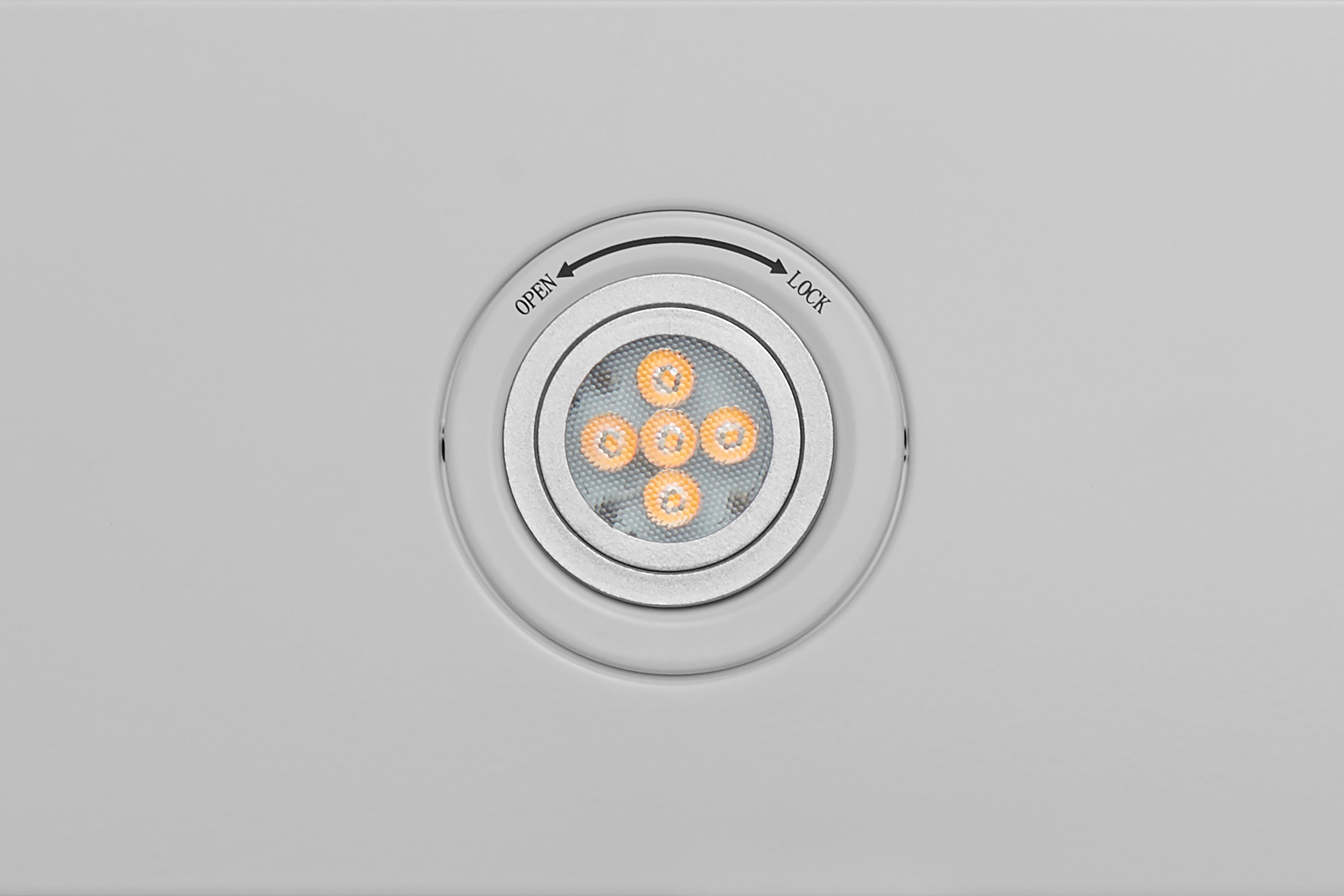 Under-cabinet range hood control dial in white finish with LED indicator lights