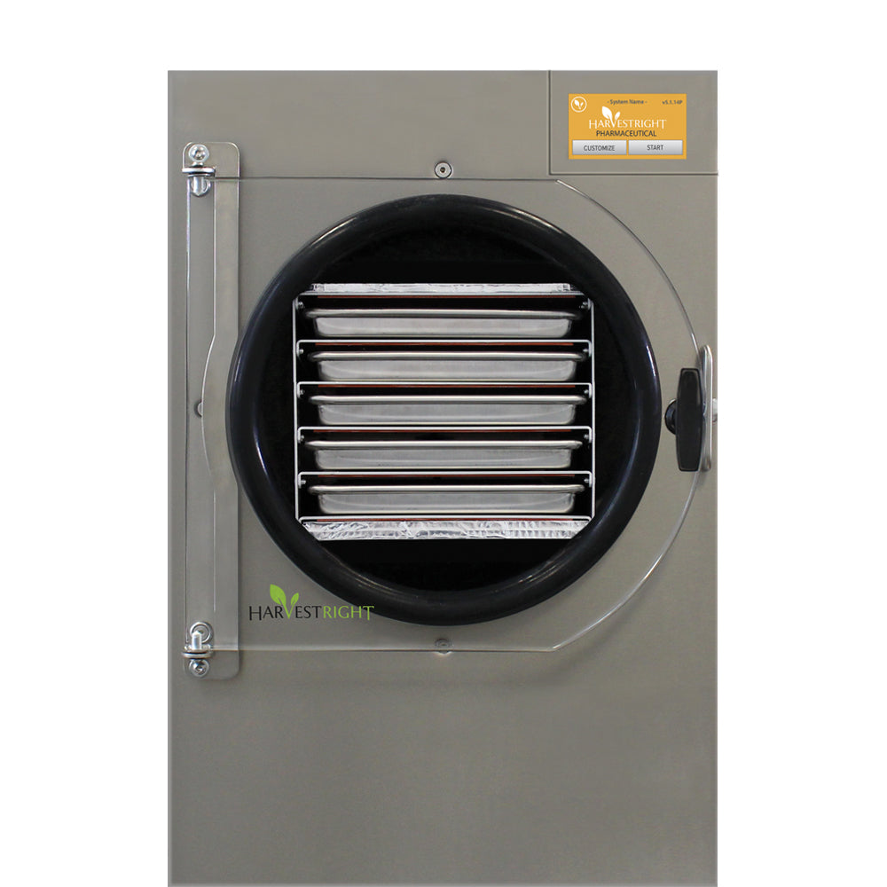 Stainless freeze dryer door with round black air intake and stacked internal trays