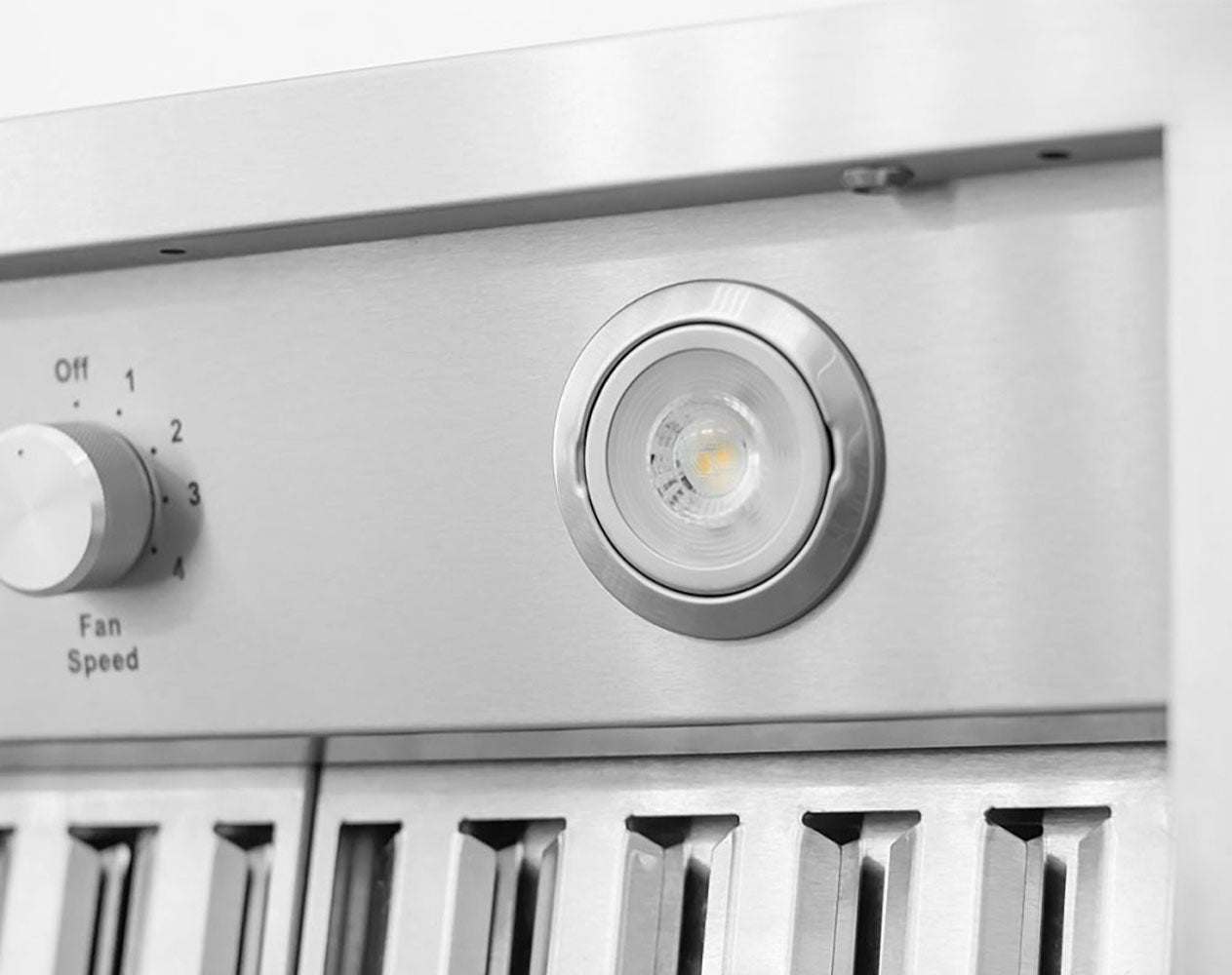 Stainless steel range hood control panel with round fan speed knob and built-in lamp
