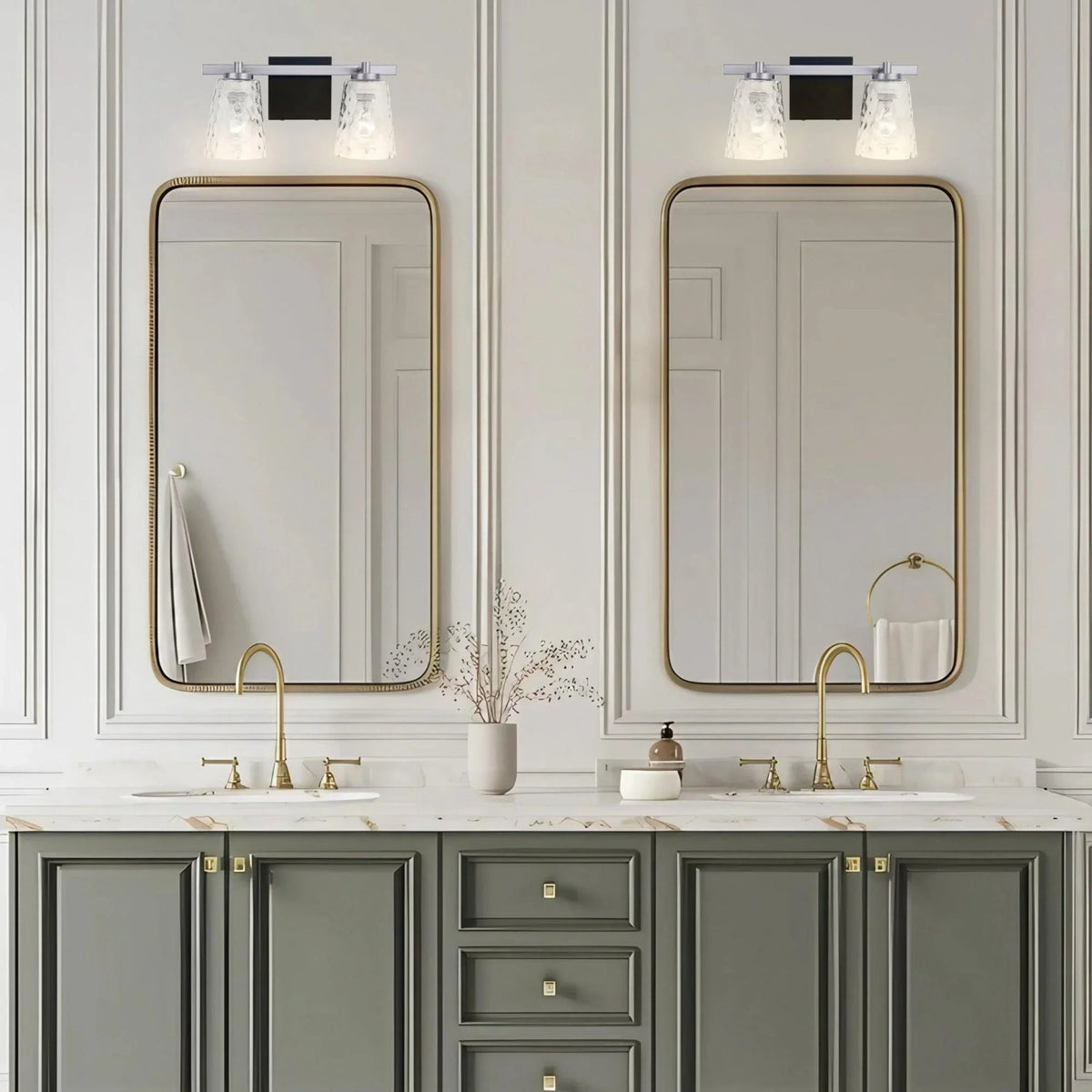 2-light vanity light with clear glass shades and gold-toned backplate, front view.