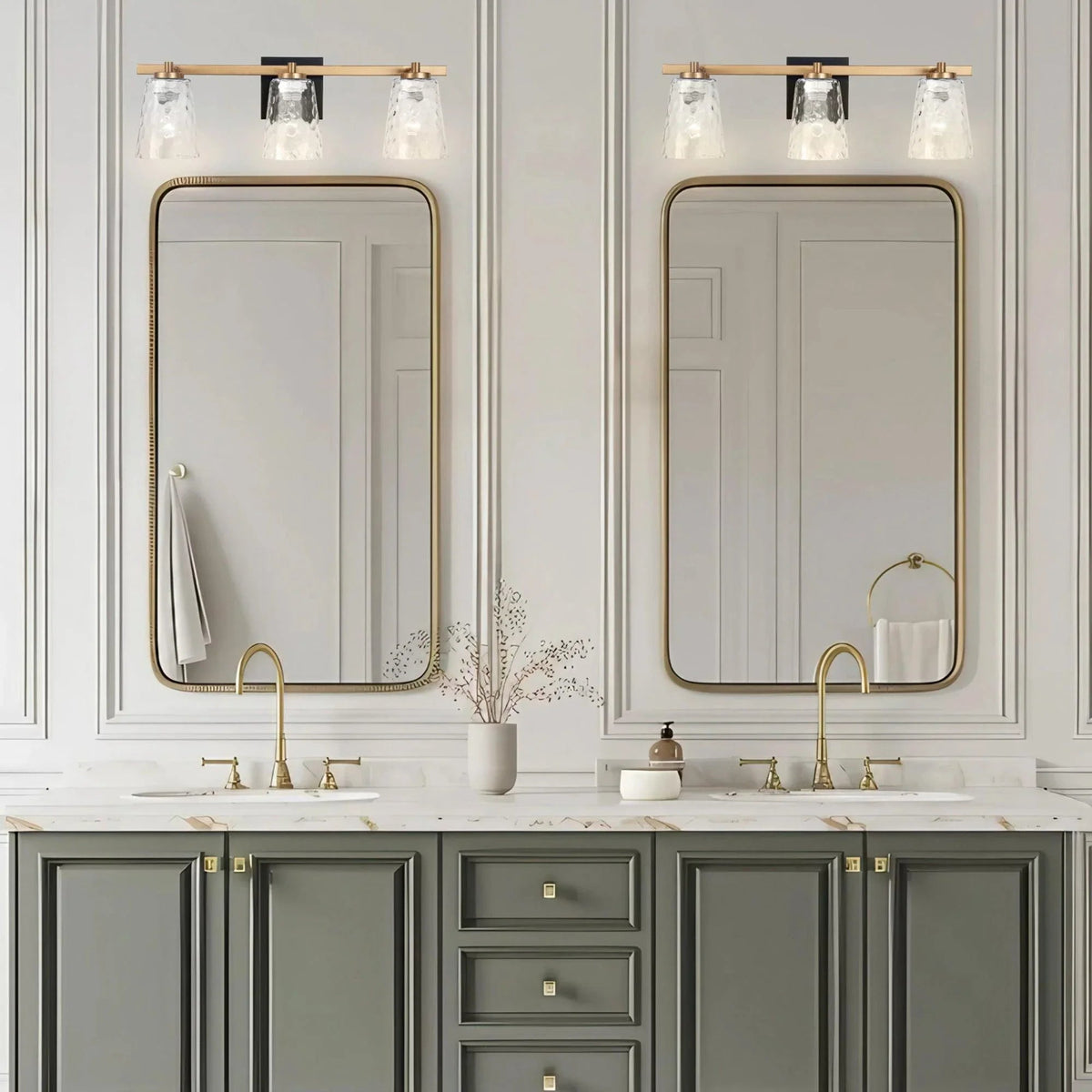 3-light vanity light with gold-toned frame and clear textured glass shades.