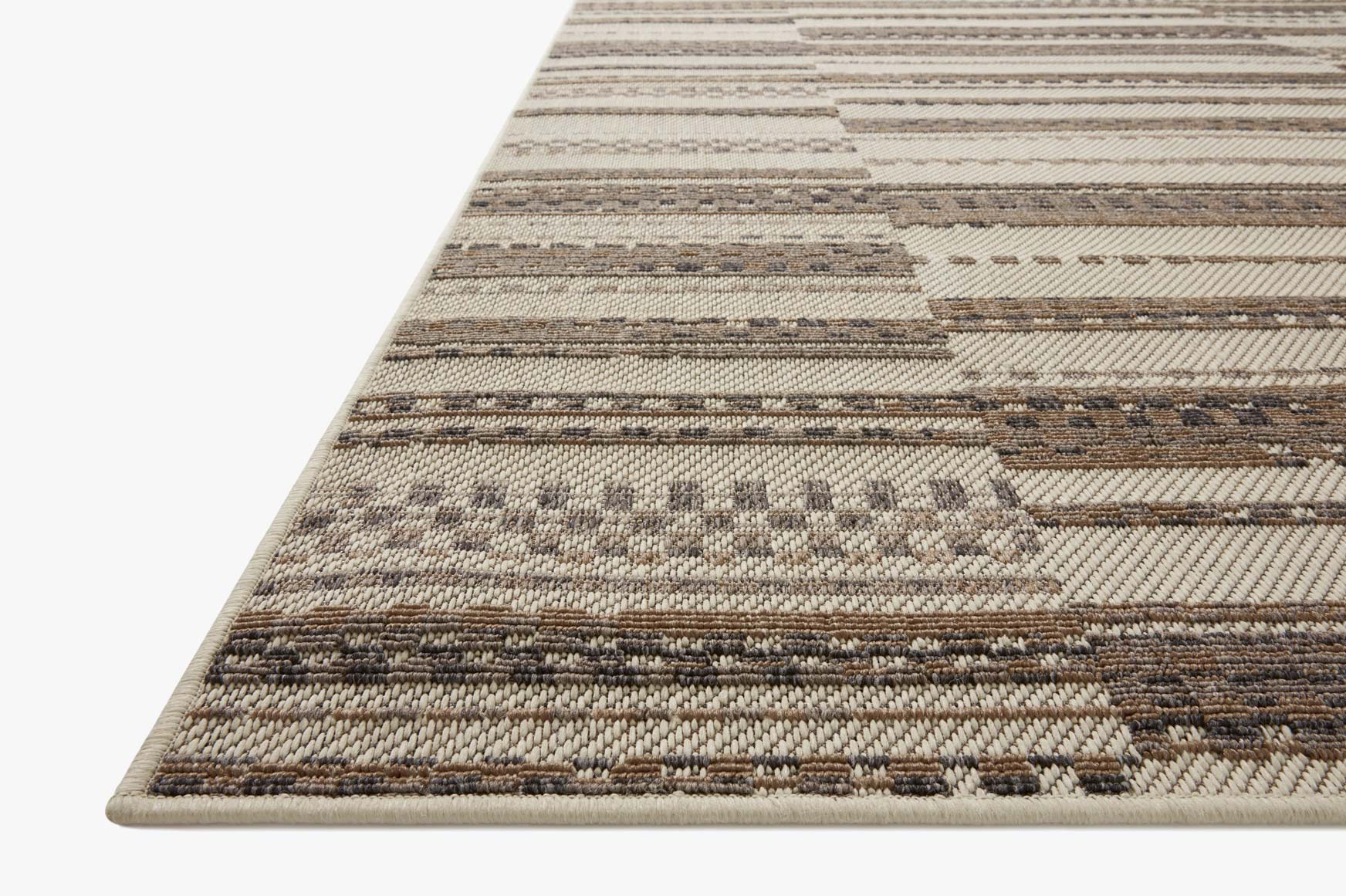 Ivory and taupe striped indoor/outdoor accent rug with textured woven pattern, edge binding