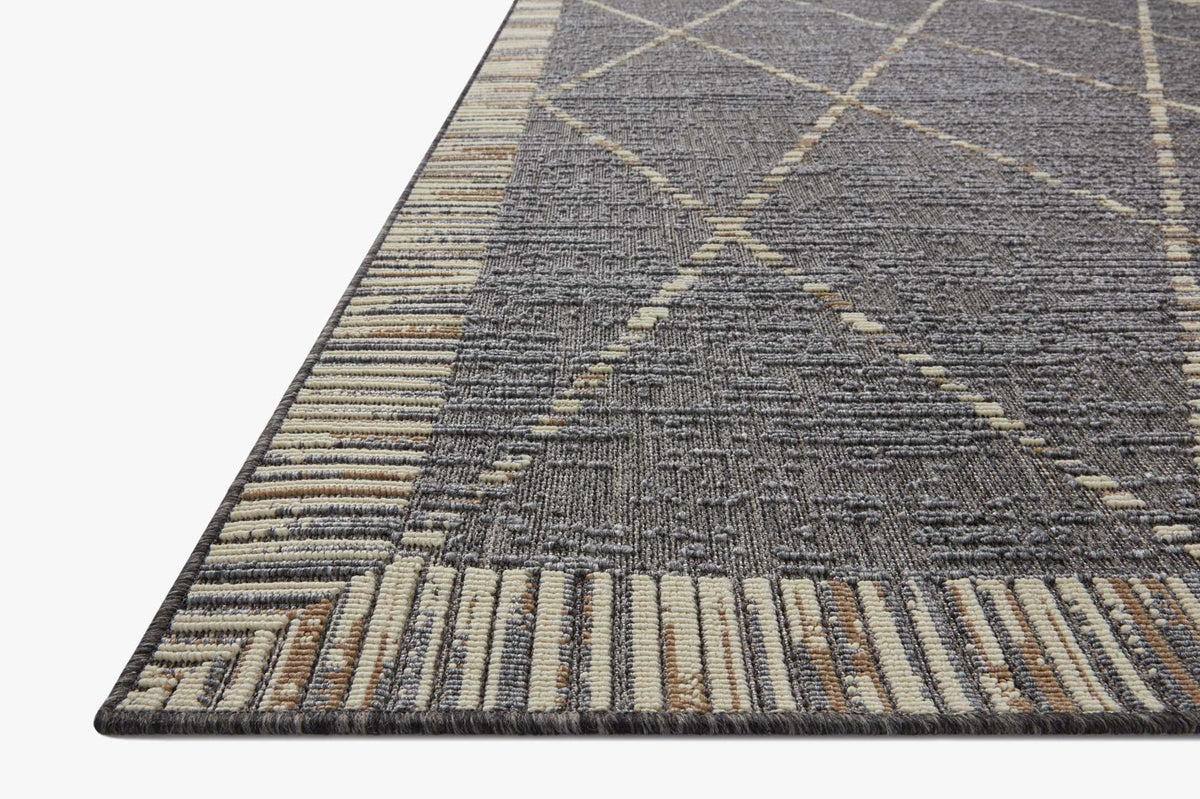 Slate gray indoor/outdoor area rug with geometric pattern and striped border trim
