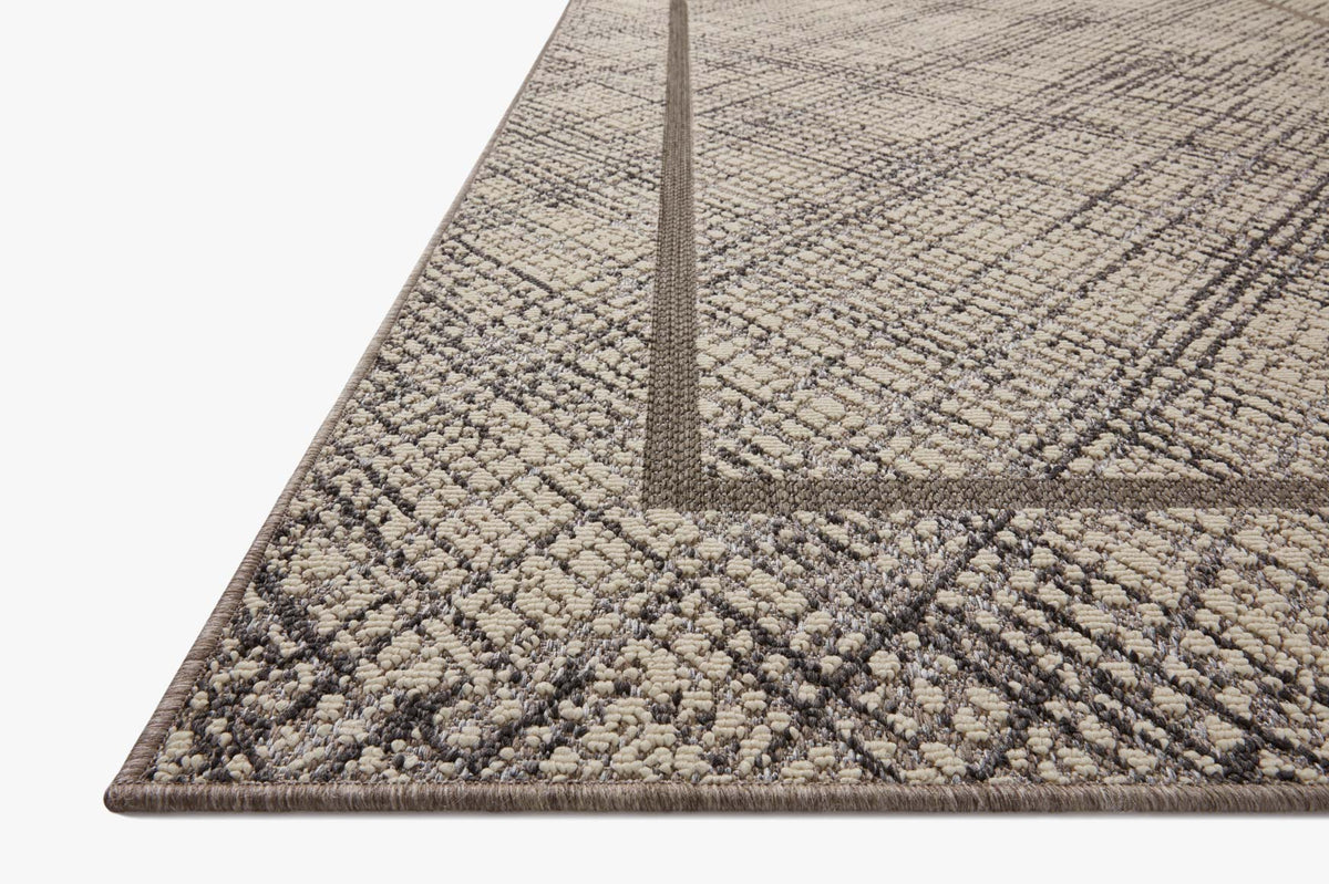 Indoor/outdoor area rug, geometric ivory-and-charcoal pattern, flatwoven border
